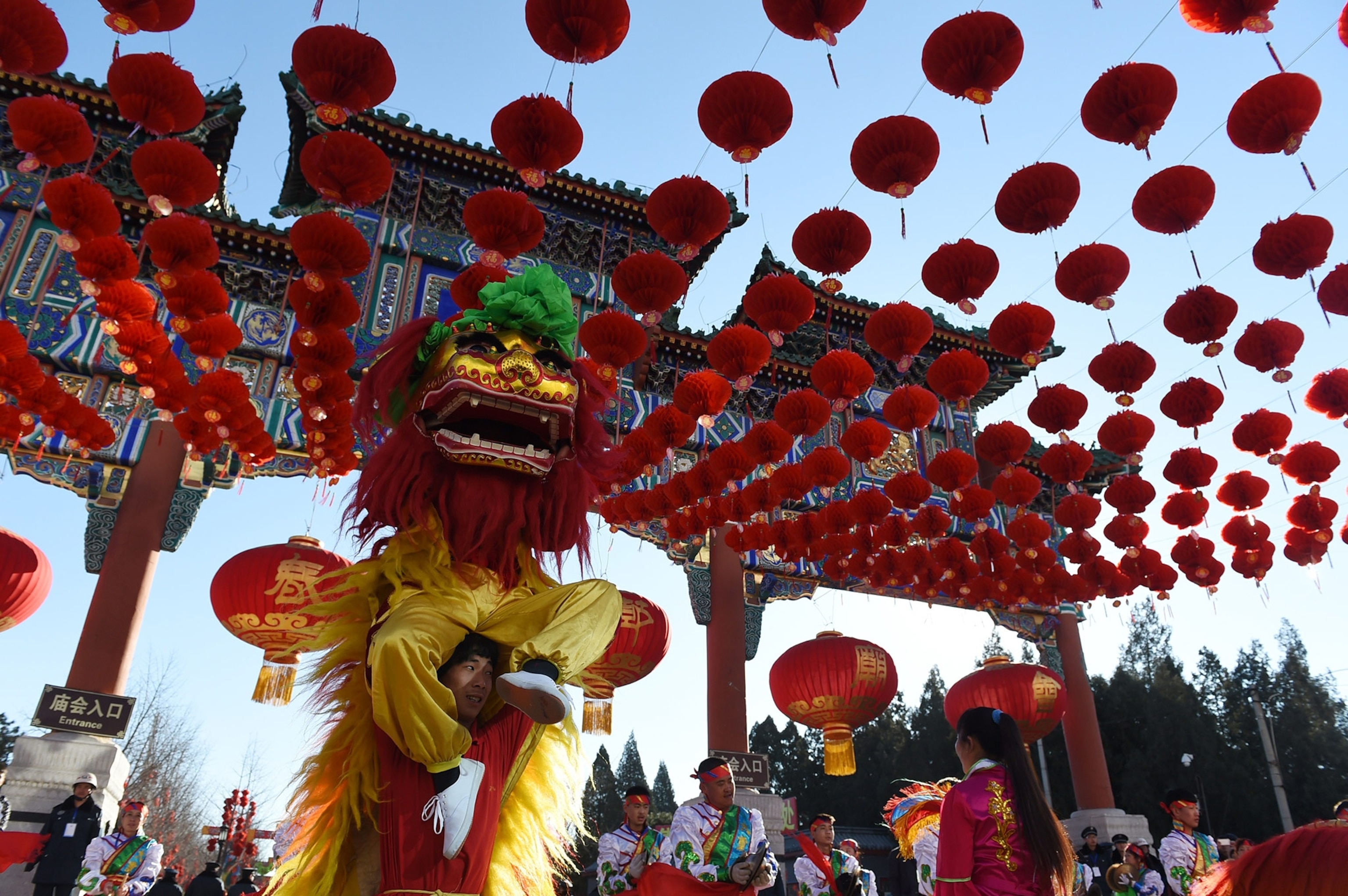 lion dancers performing at the Ditan Park temple in Beijing, China
