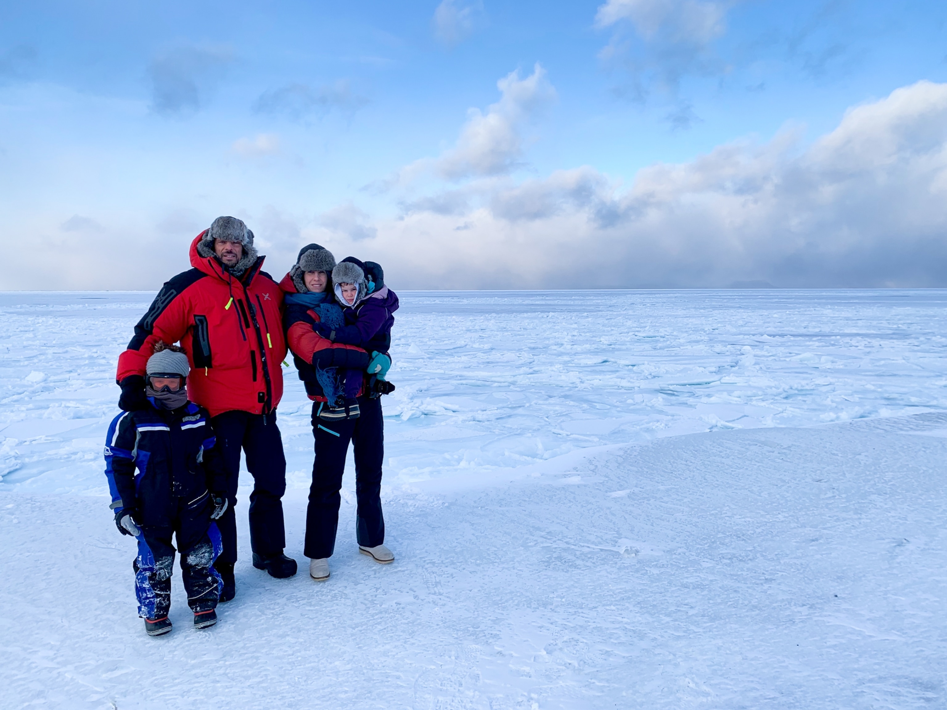 Picture of of two adults with two small children.