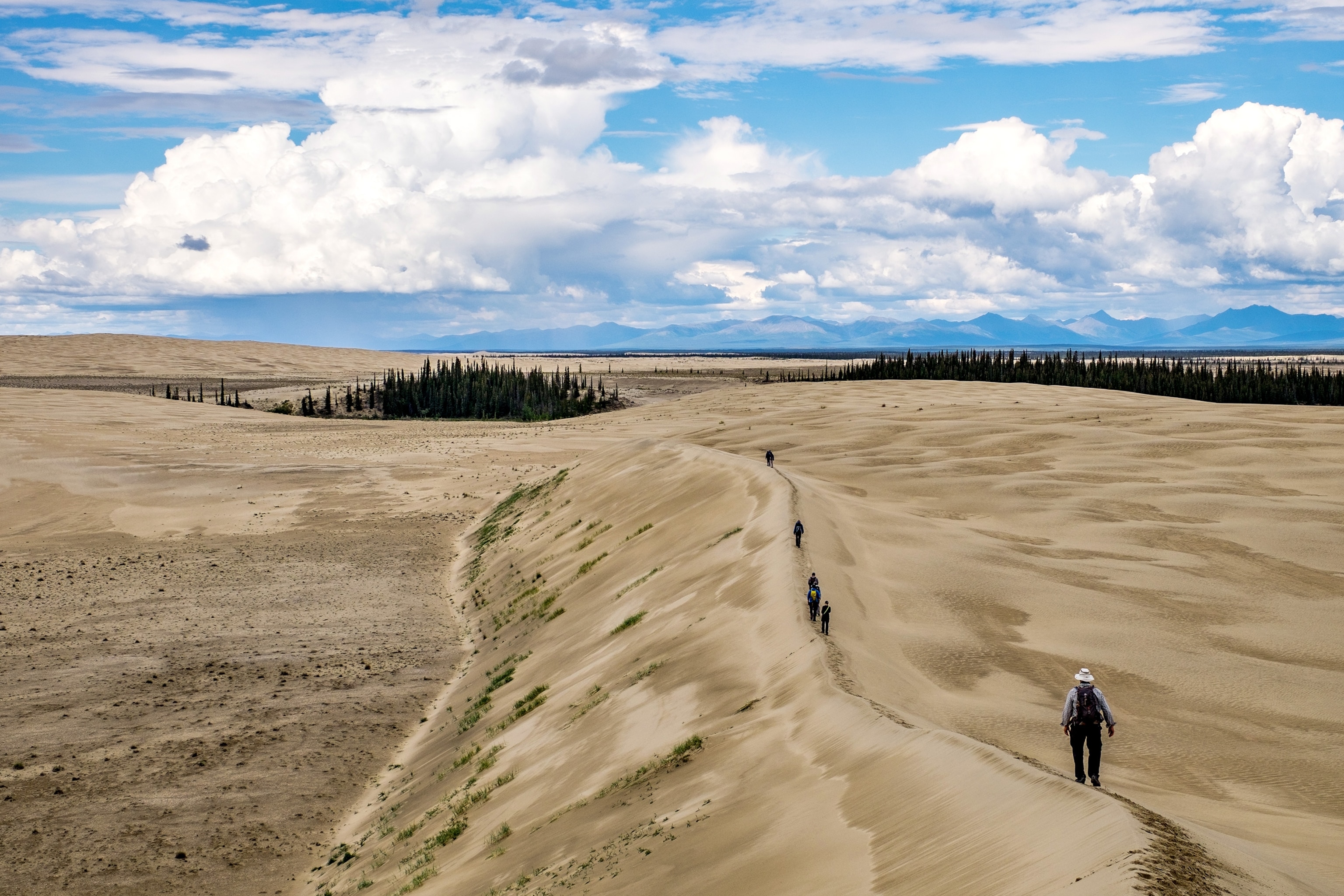 a person hiking on a sand dune in Kobuk Valley National Park, Alaska