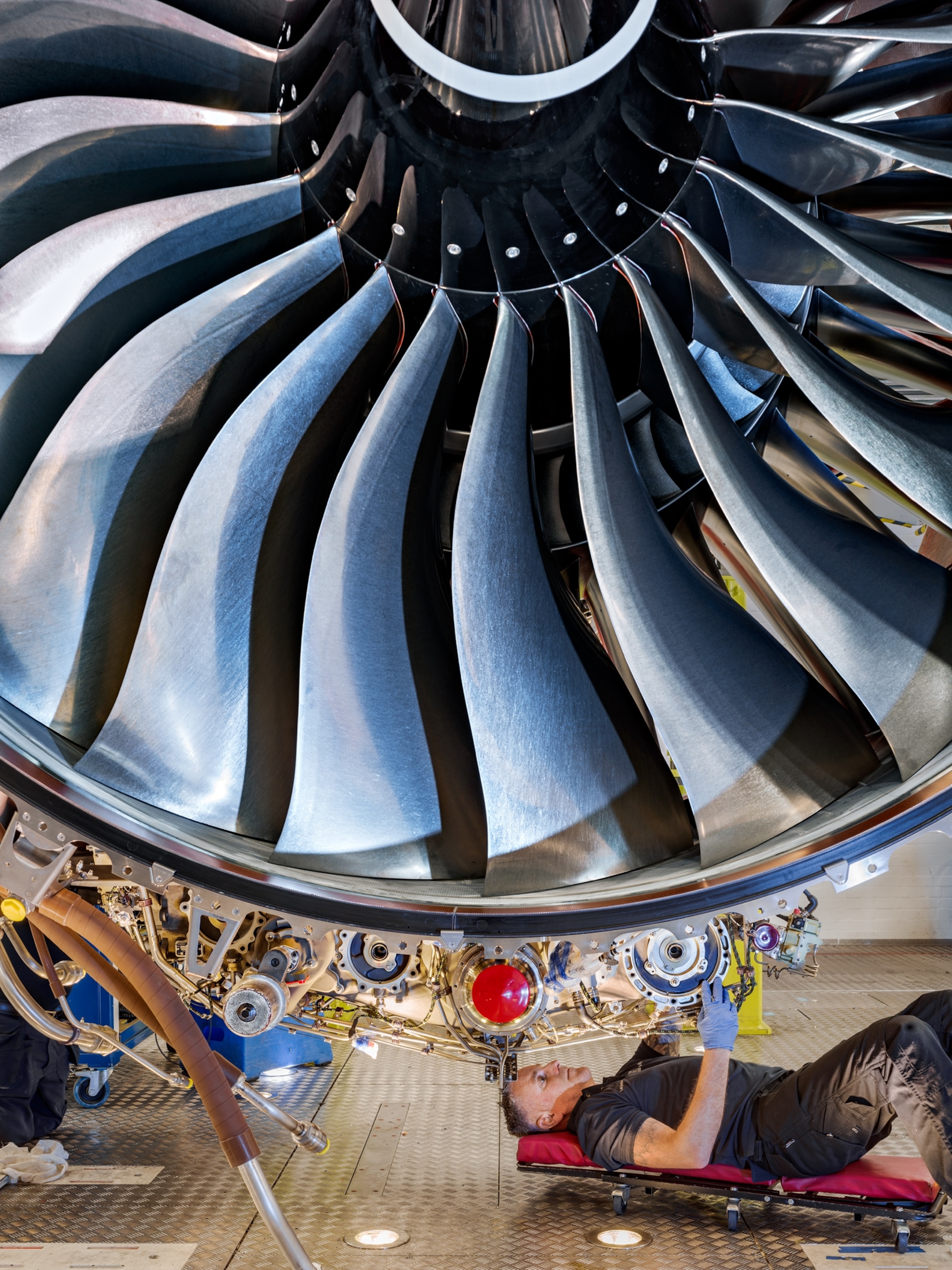 Picture of mechanic under turbine.