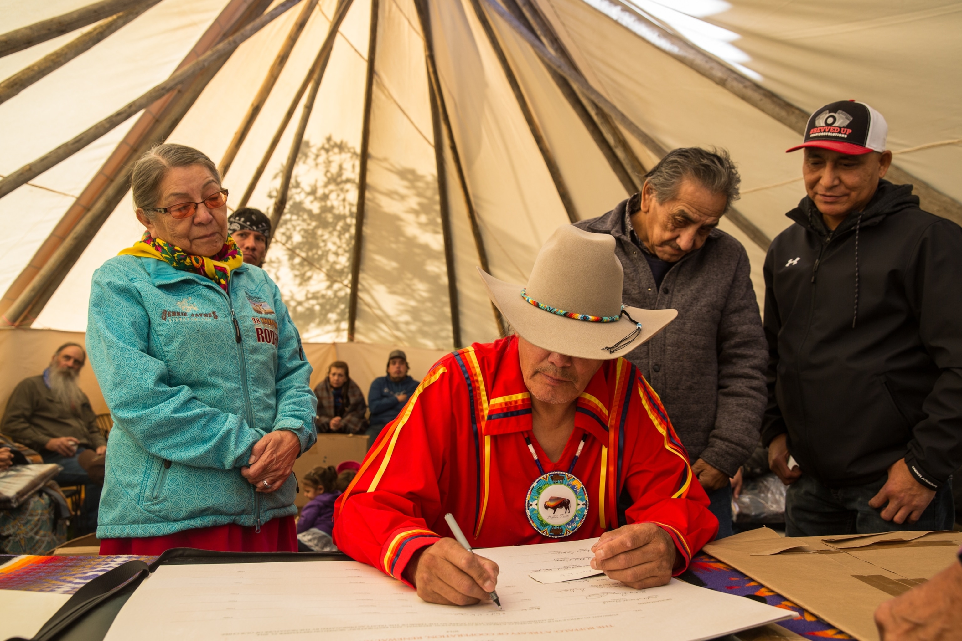 Brian Lee from Erminskin Cree Nation in Alberta signs on to Buffalo Treaty.