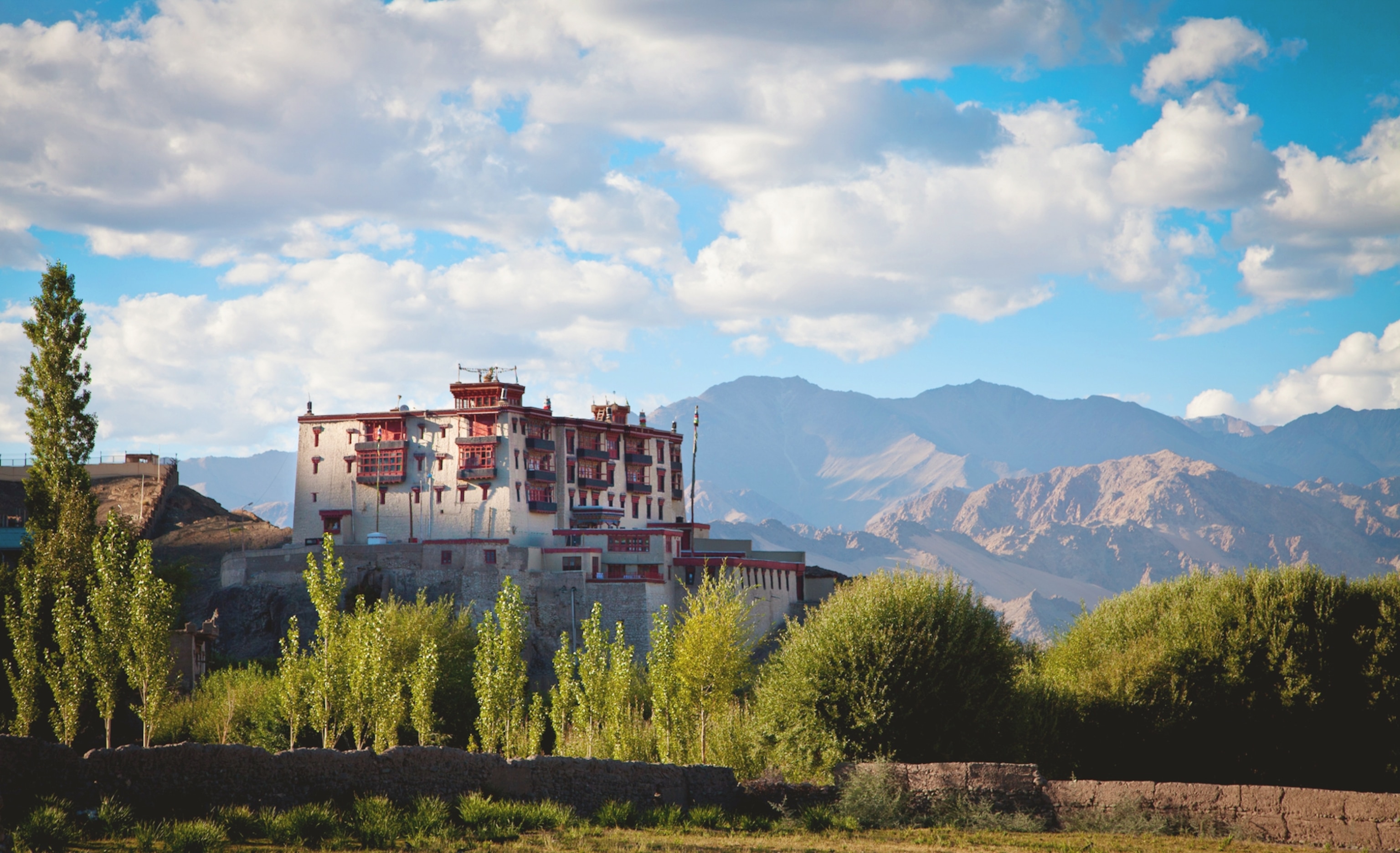 Stok Palace set against a backdrop of mountains.