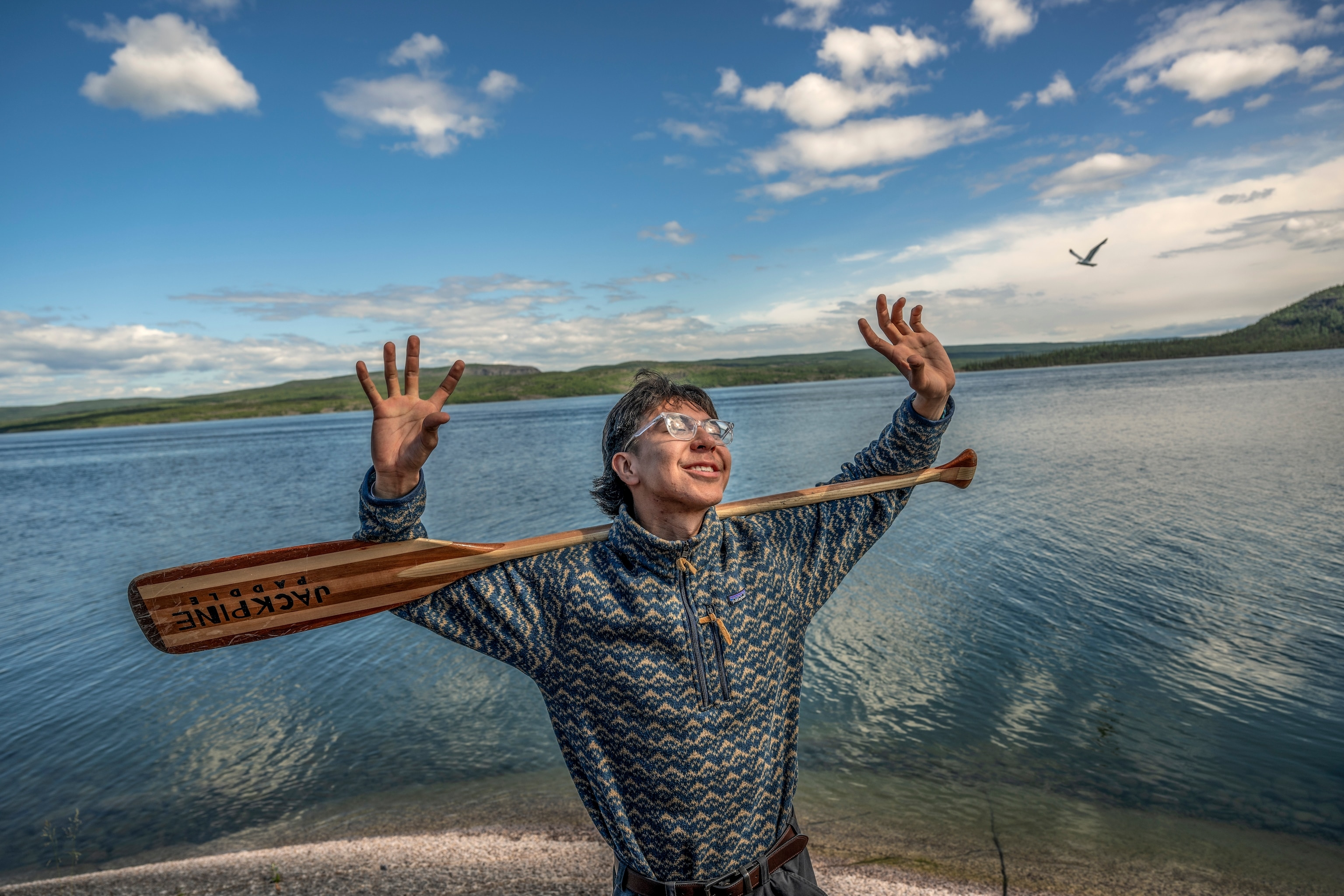 Ashton Gahdele of the Dene First Nation prepares to embark on a canoe trip with youth and community members of the on Great Slave Lake. The trip, named “Retracing Our Roots,” will journey through Thaidene Nëné— Canada’s newest national park.