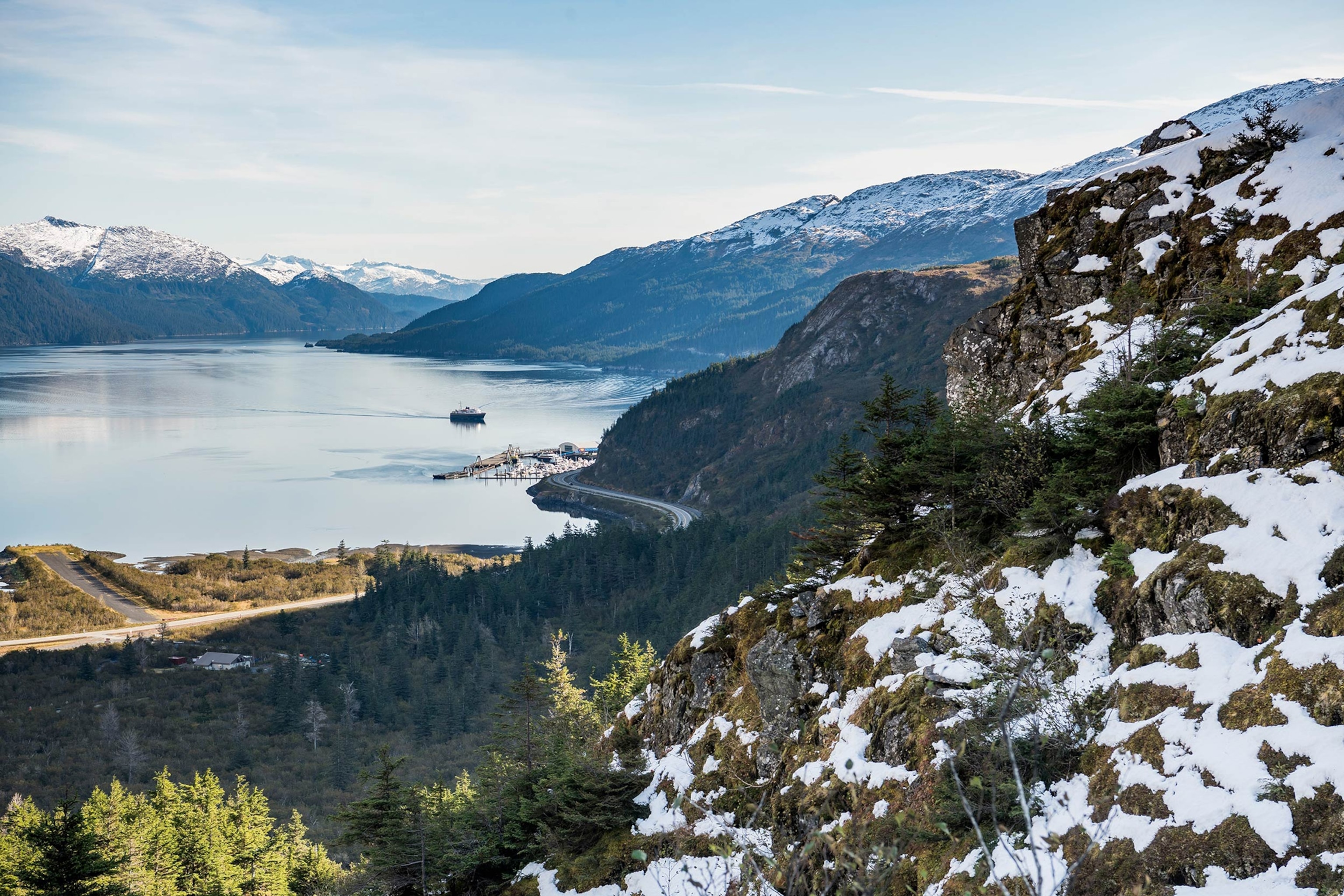 An Alaska Marine Highway ferry pulls into the small community of Whittier, Alaska at the end of Passage Canal.