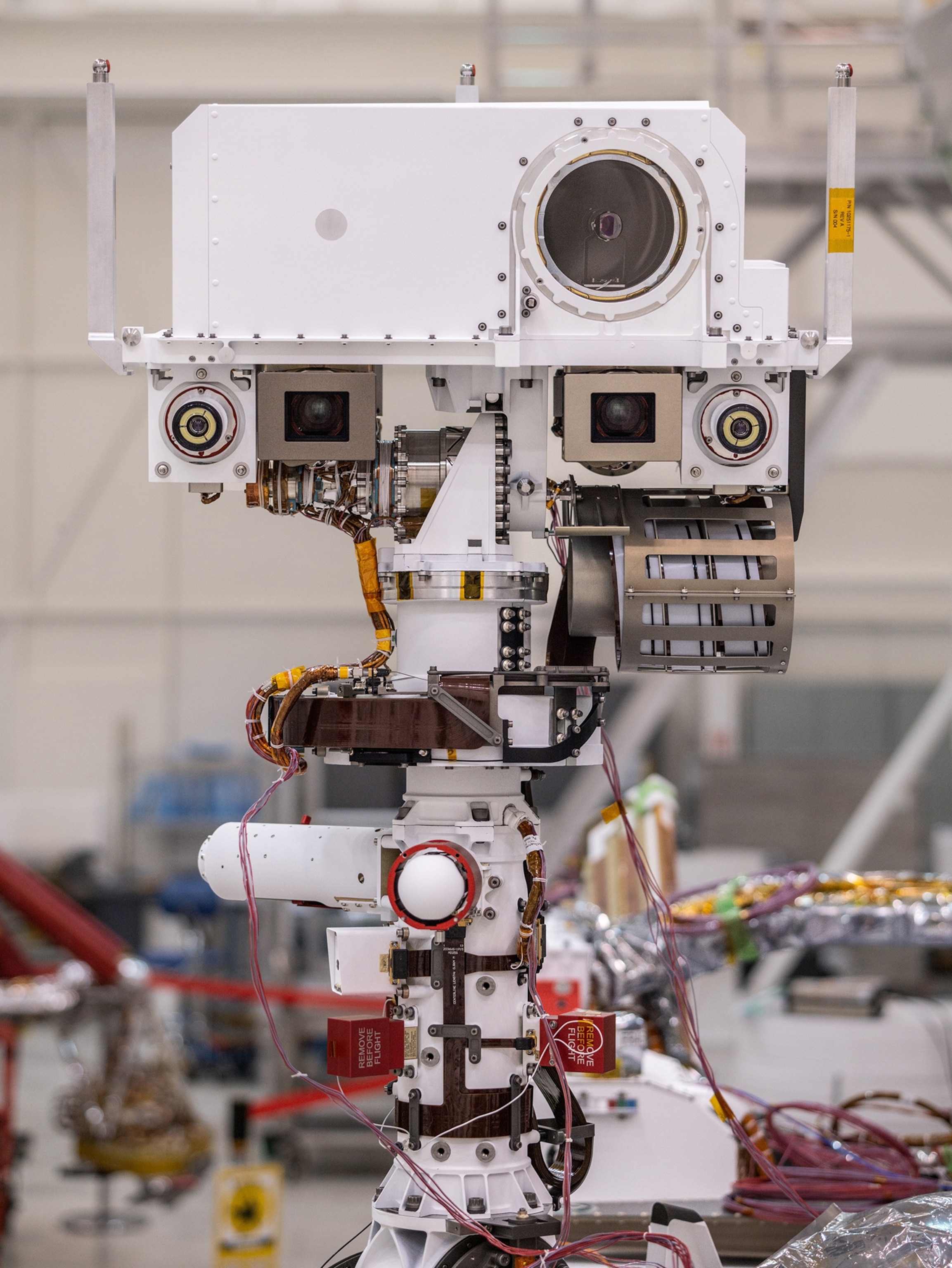 white camera on complex stand.