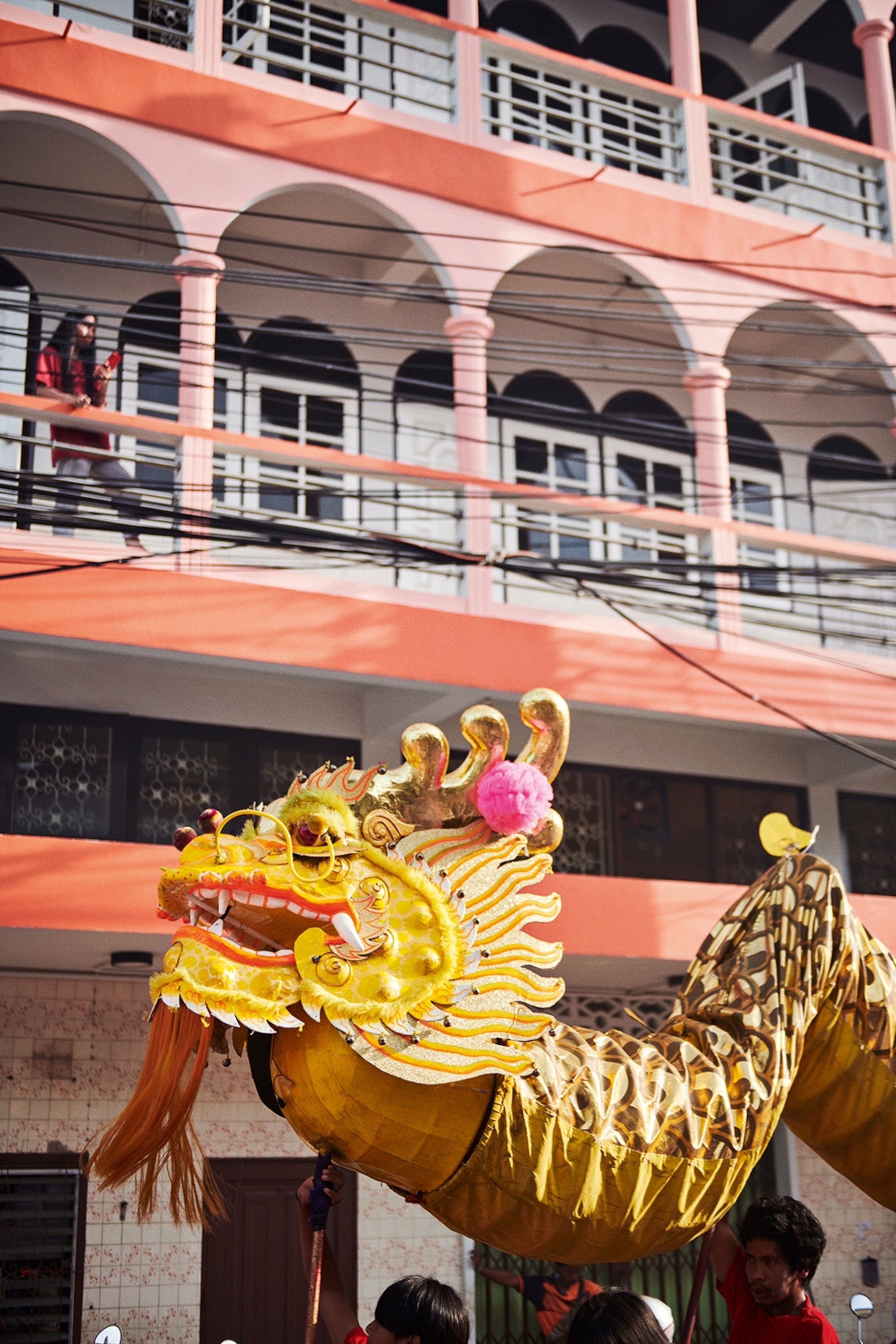 Devotees at a festival in Thailand carry a dragon statue as part of a procession