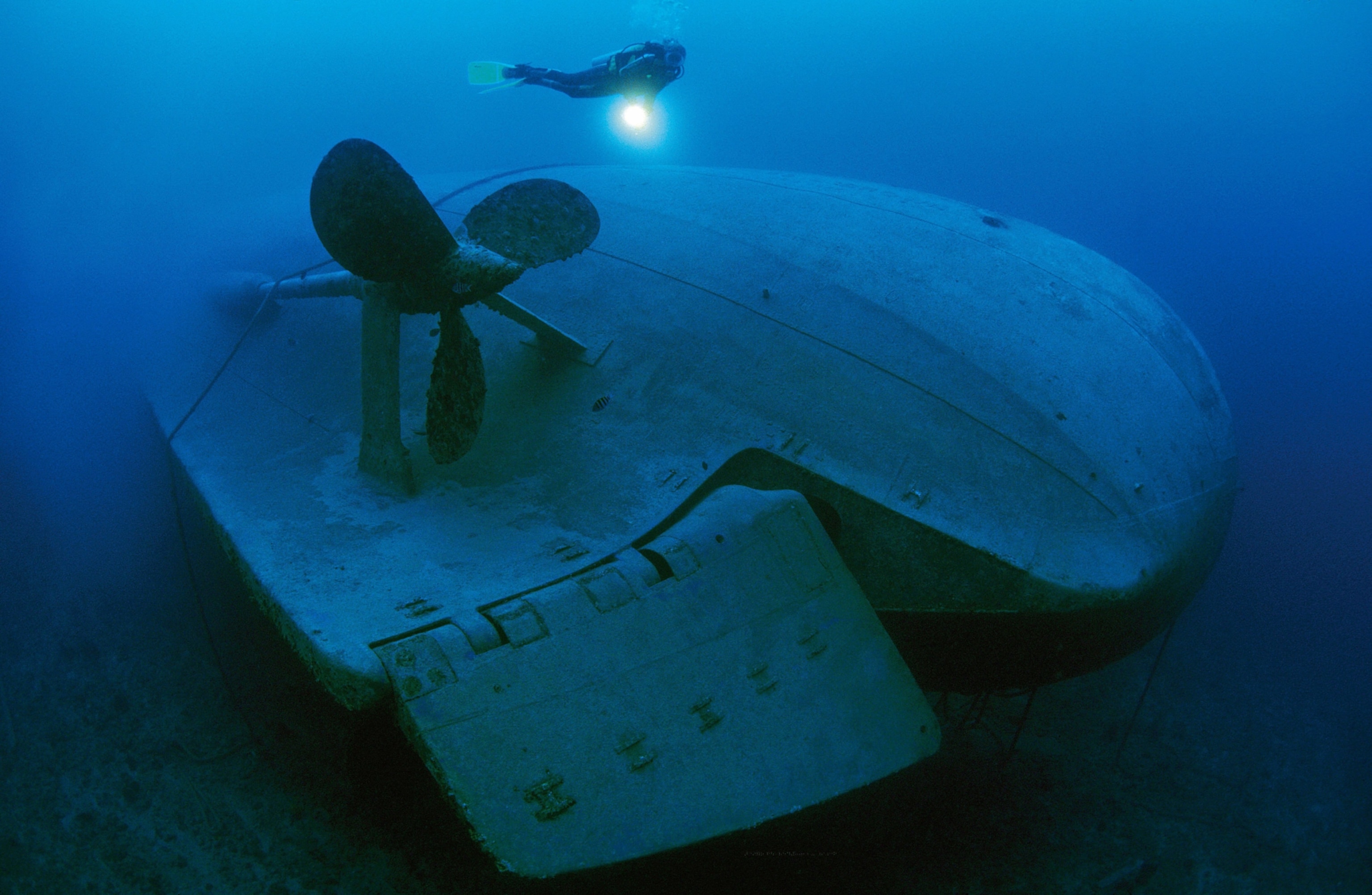 Scuba diver inspects a shipwreck