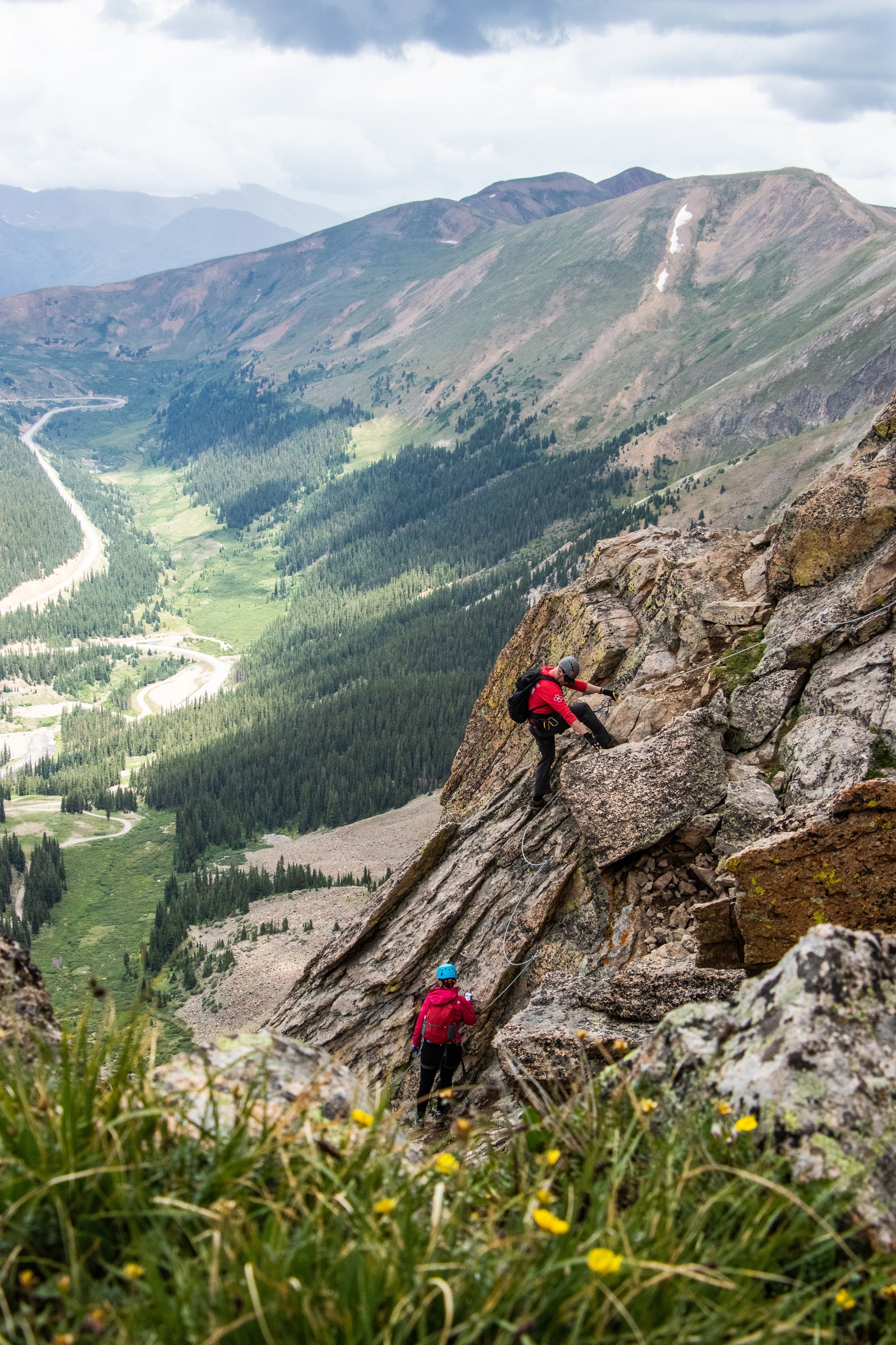 Two guests climb the highest Via Ferrata in North America at Arapahoe Basin Ski Area