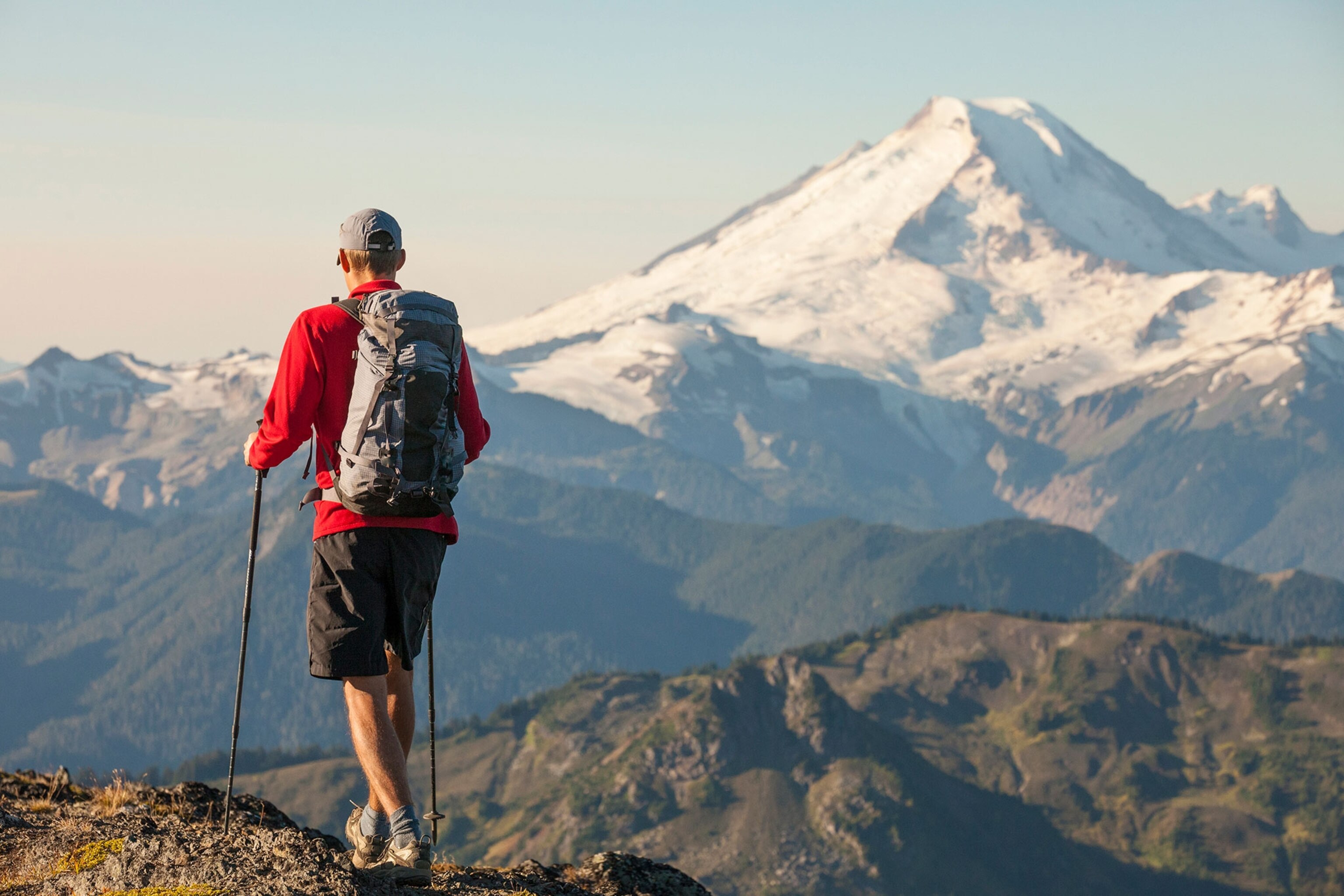 a man hiking in North Cascades National Park with view of Mount Baker