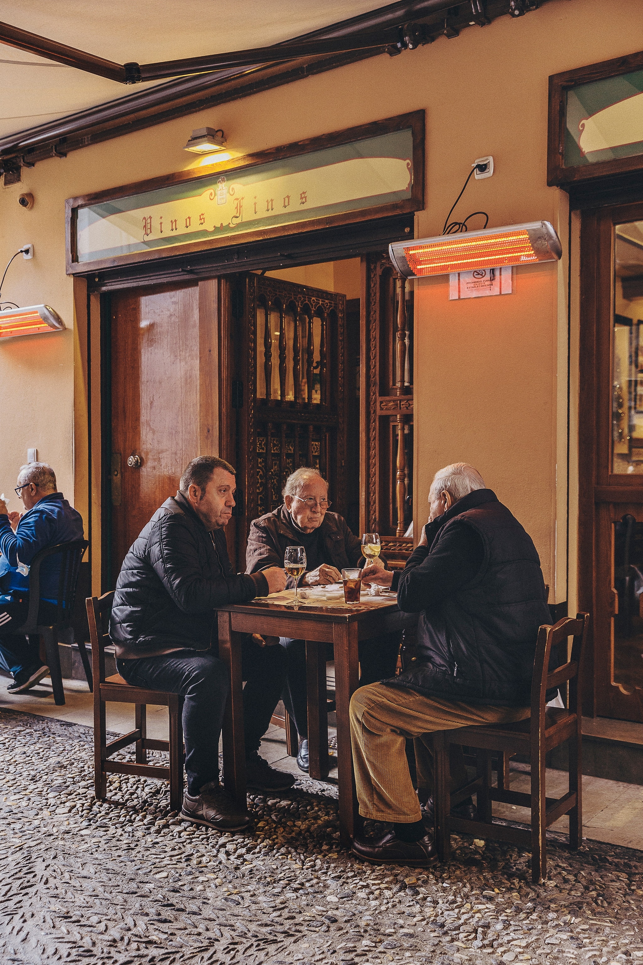 Locals enjoy an al-fresco lunch at Bodega Castañeda