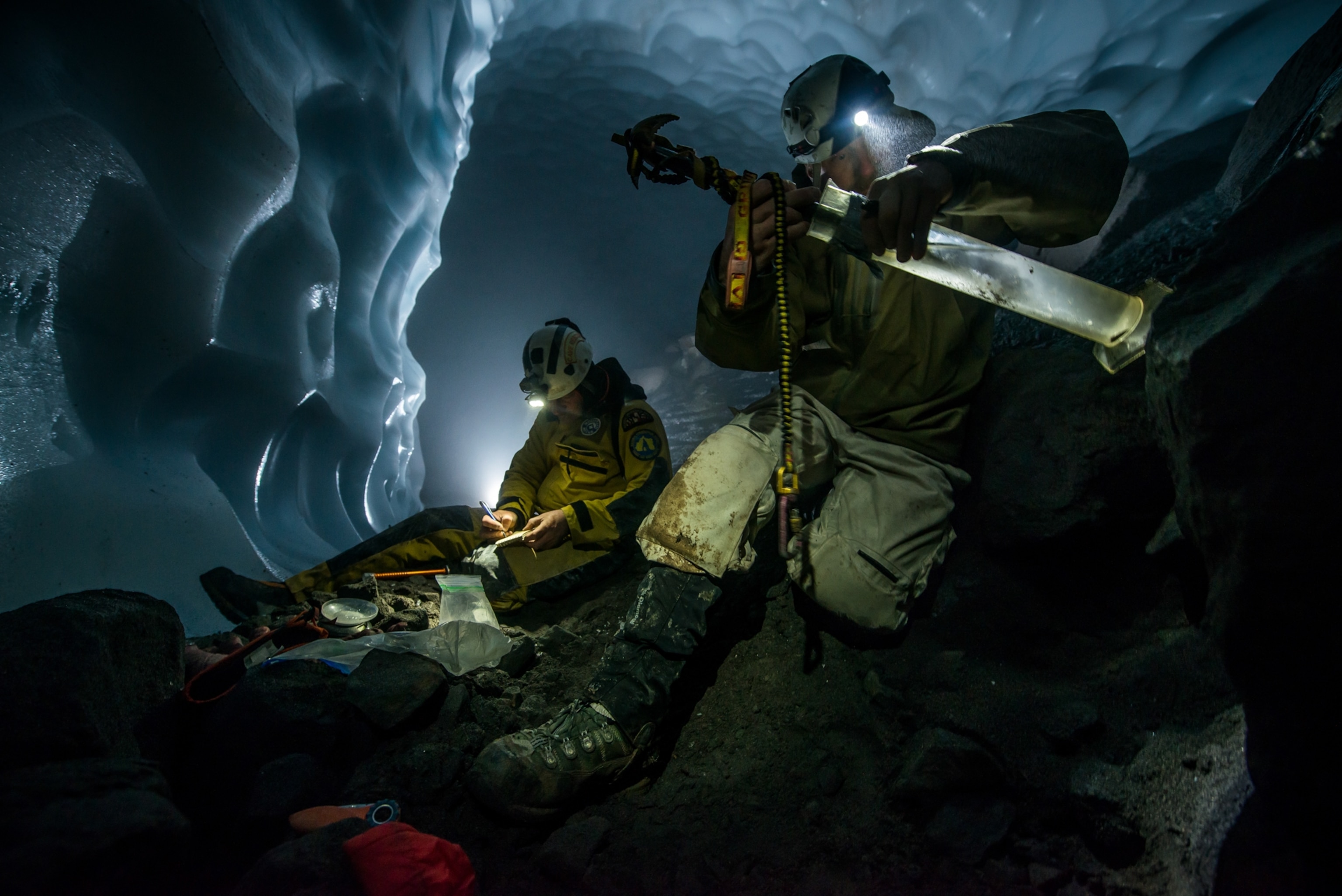 Expedition members measuring ice density in the caves