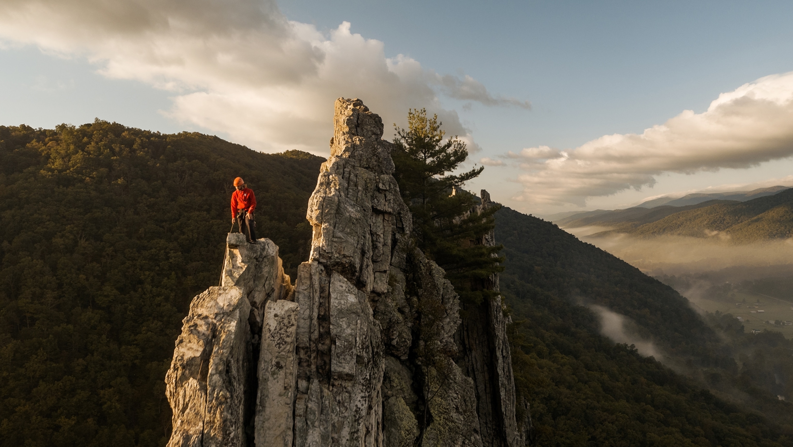 A rock climber at the top of Seneca Rocks.