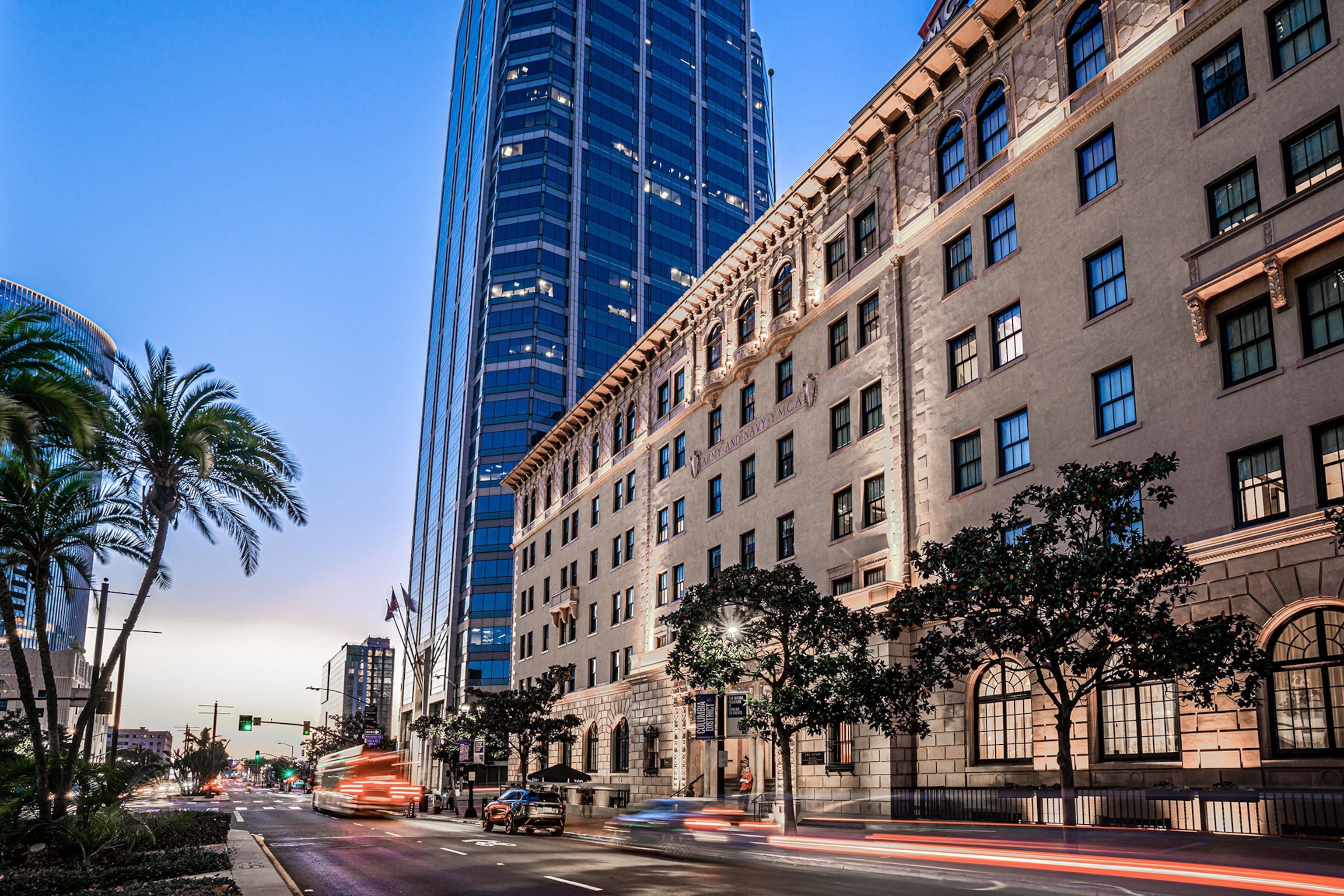 The building exterior of the Guild Hotel at dusk.