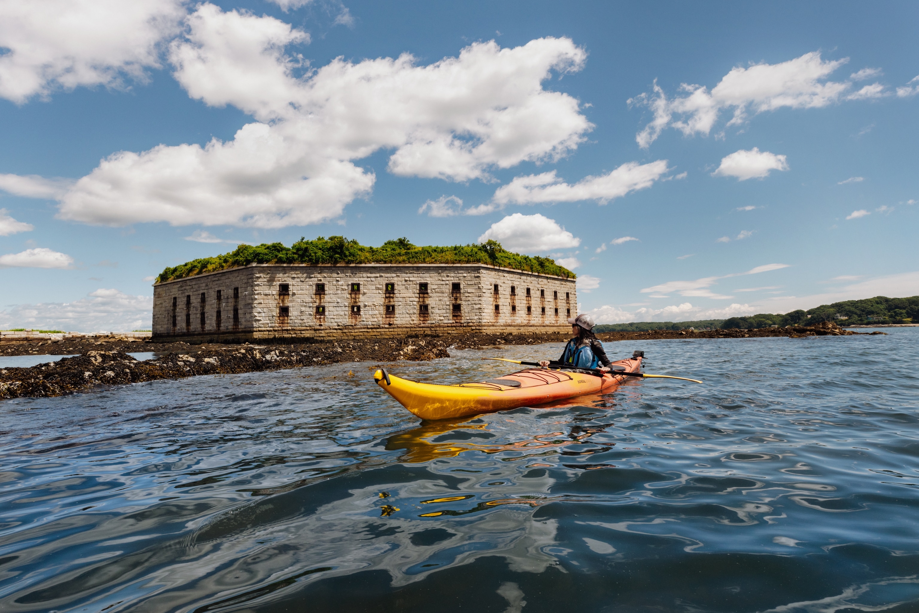 Zack Anchors from Portland Paddle and Abby Johnston of the nonprofit, Friends of Fort Gorges, kayak to Fort Gorges.