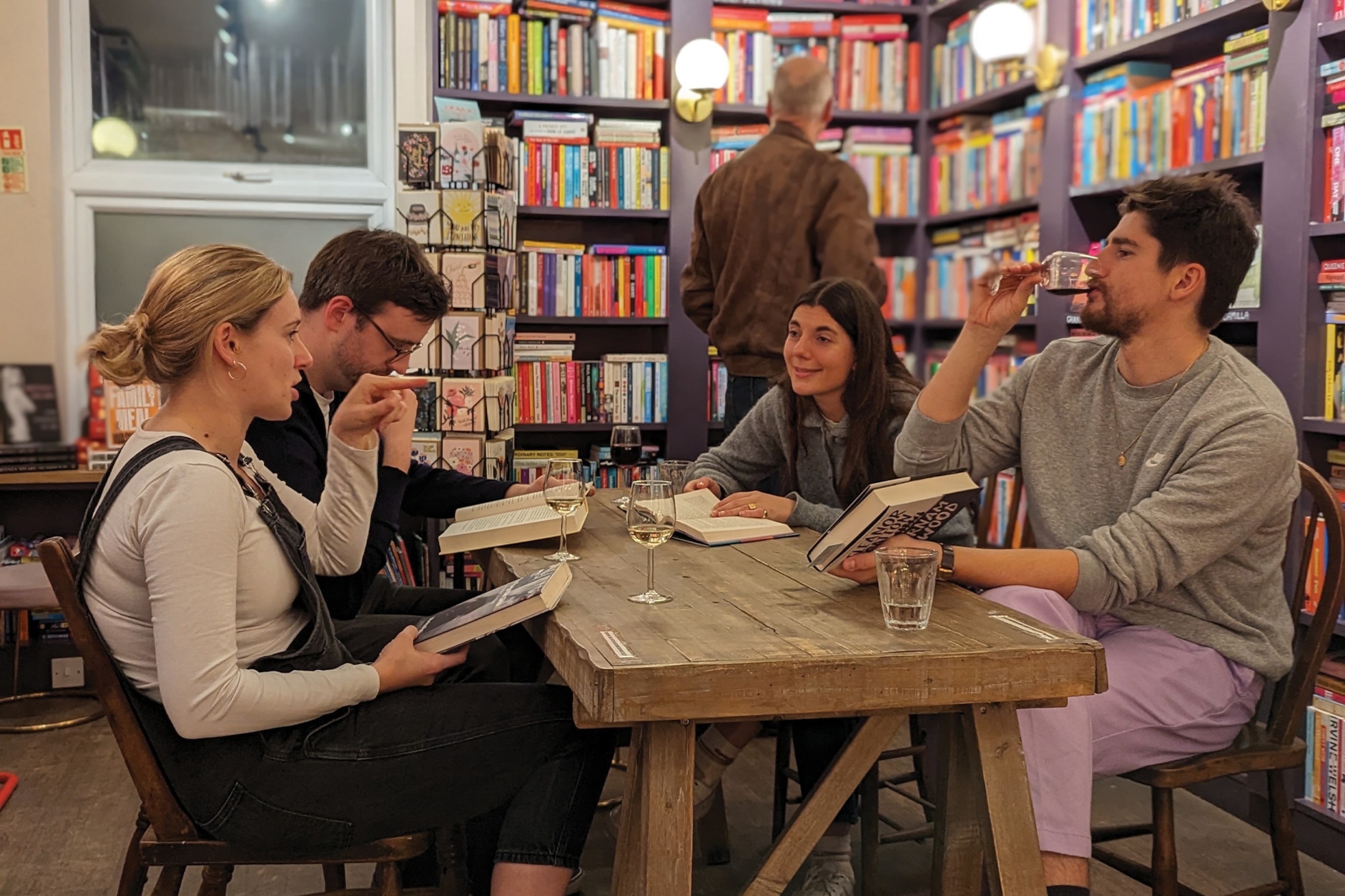 people enjoying a book bar