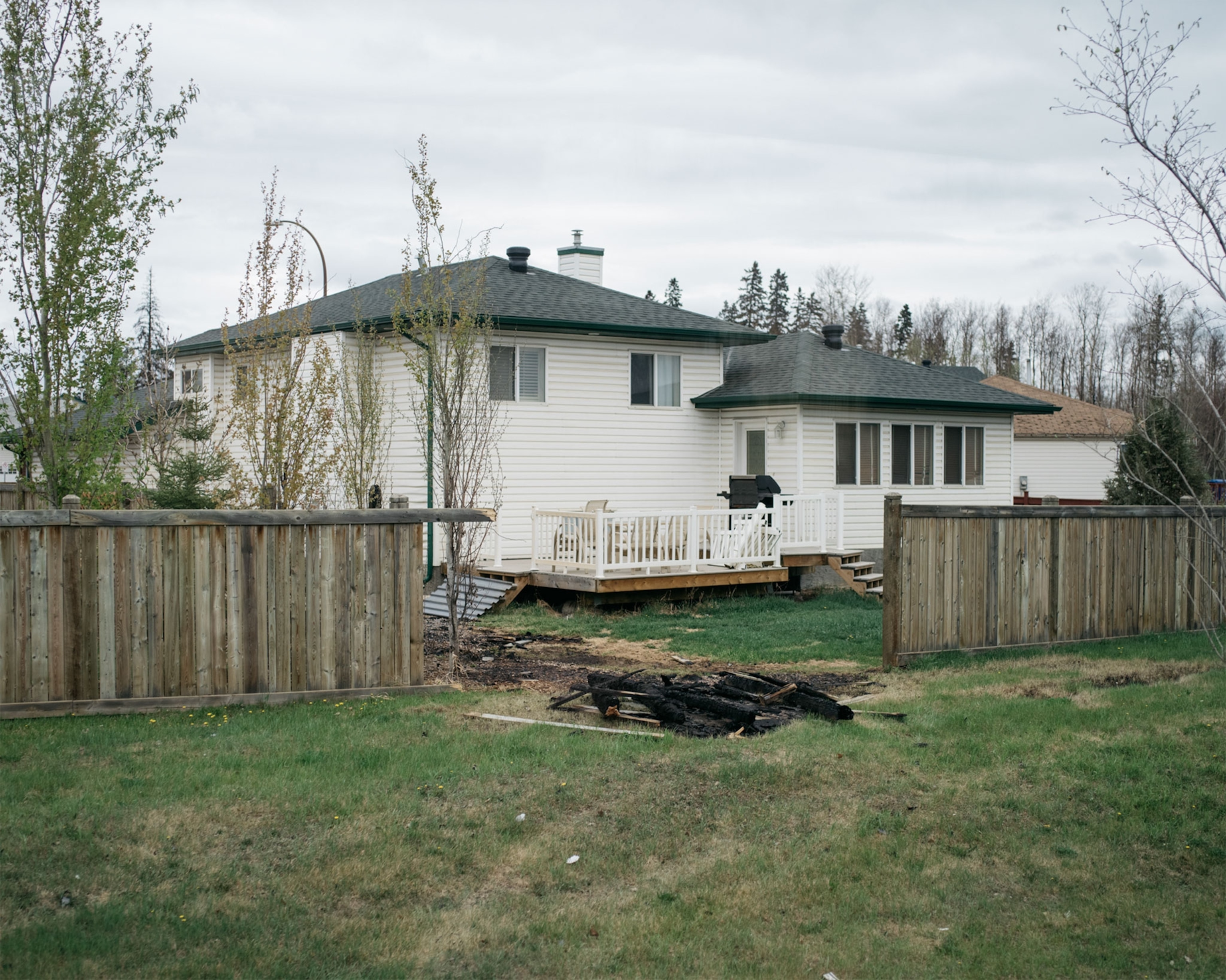 a house near fire damage in Alberta, Canada
