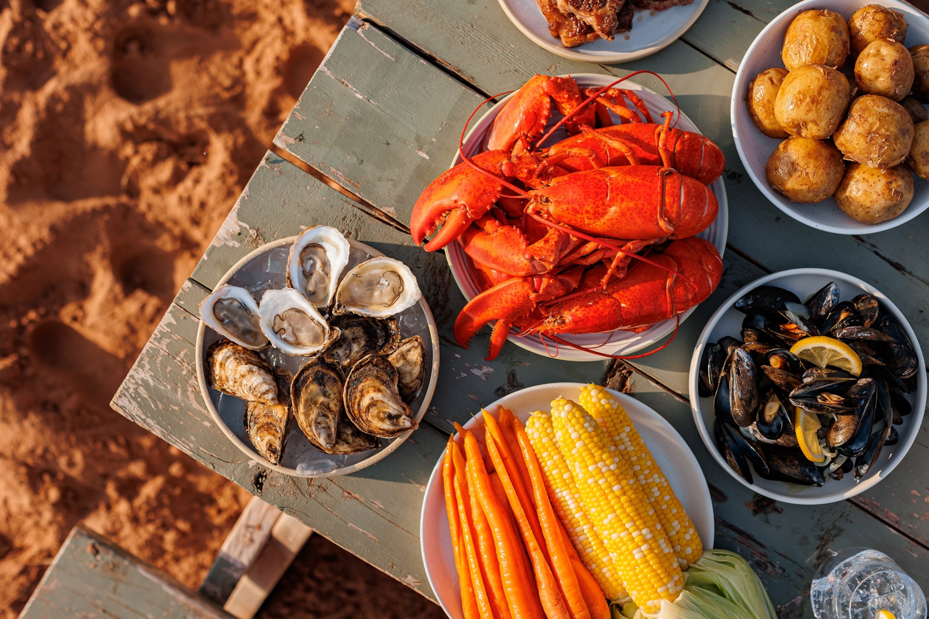 Table of seafood on a beach Prince Edward Island