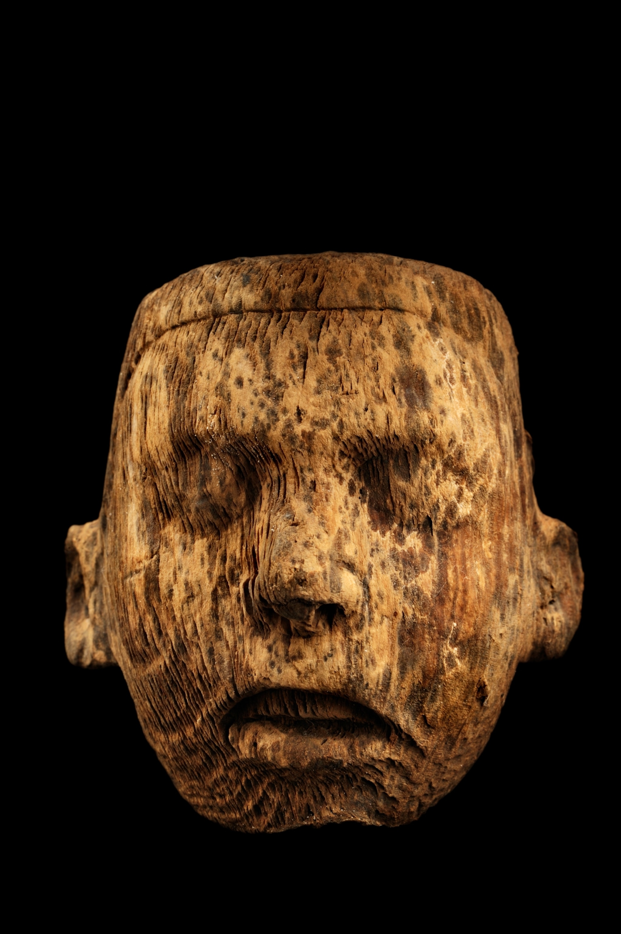 a tiny pine mask discovered in offering 126
