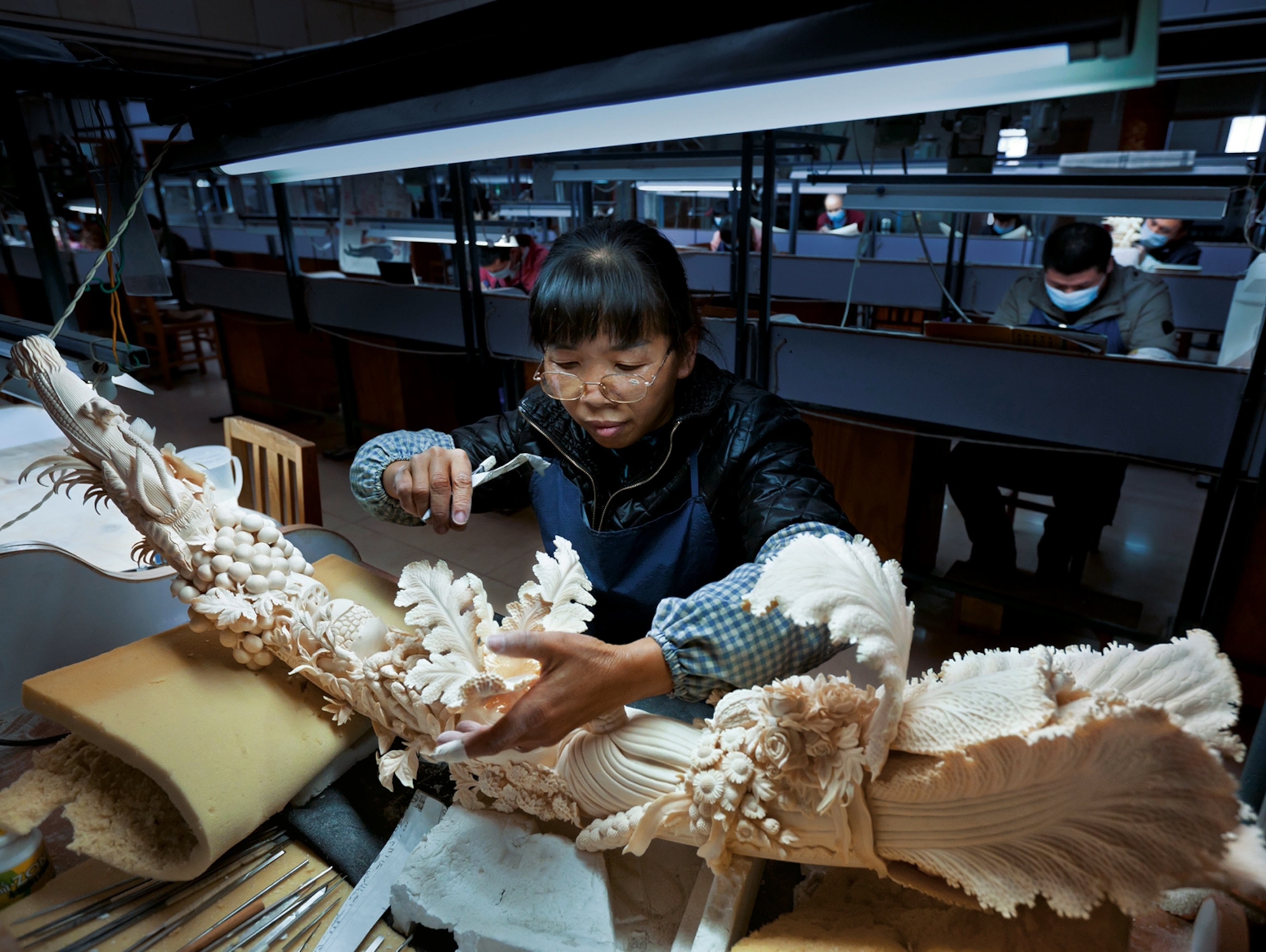 a worker in China's largest ivory carving factory