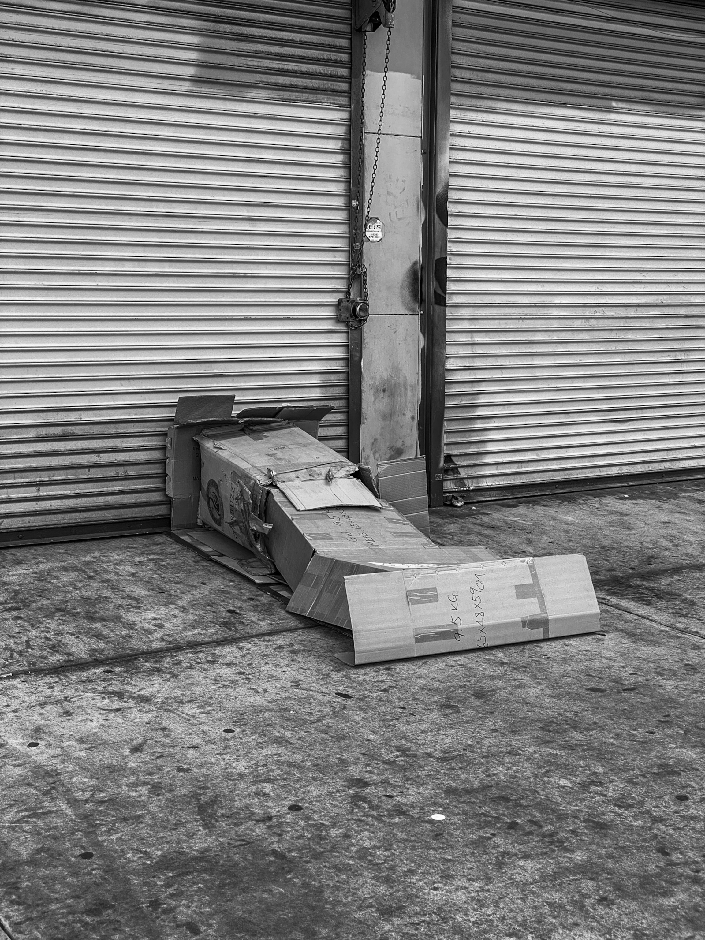 cardboard boxes in the shape of a body on the sidewalk