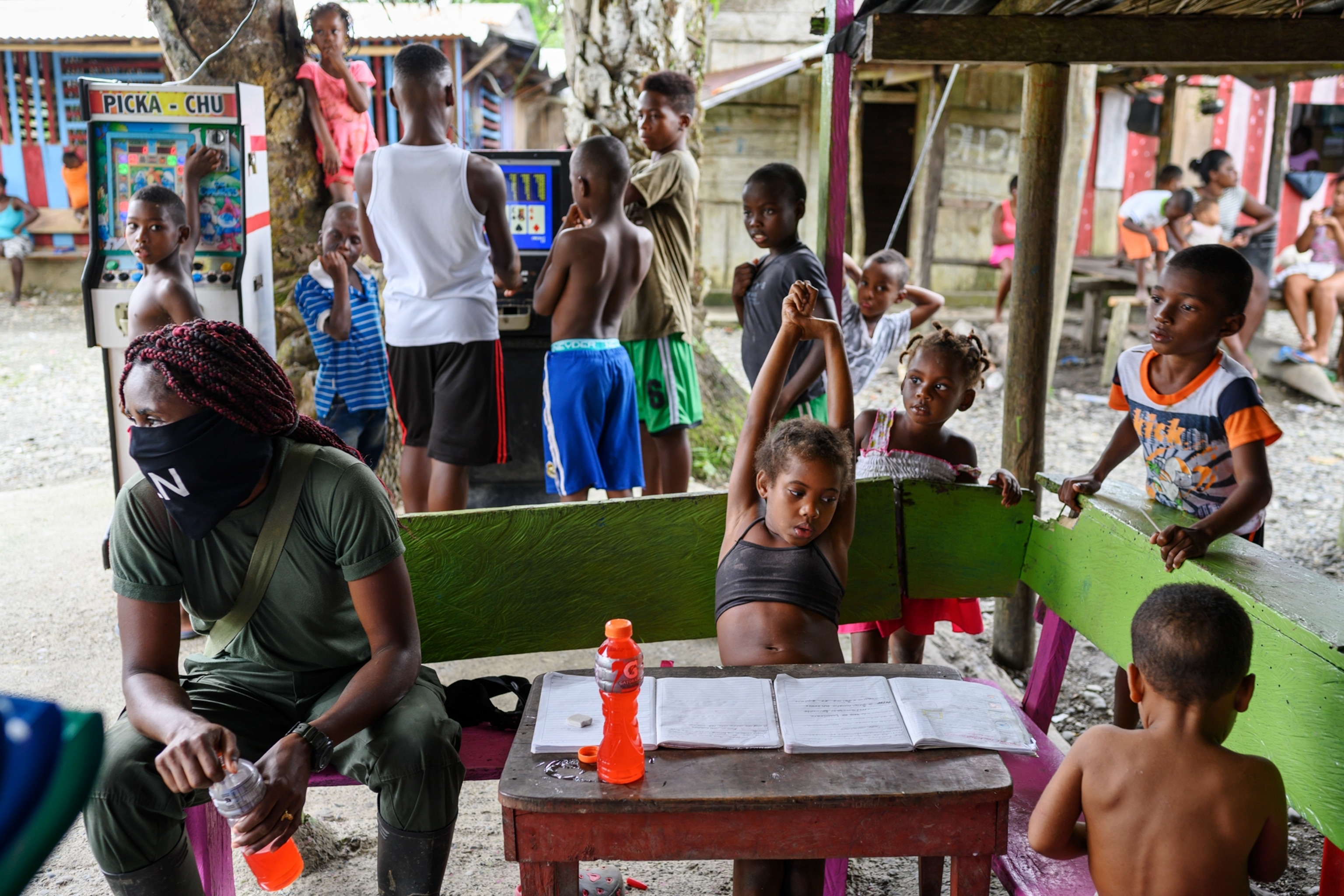 children around a table at a community center