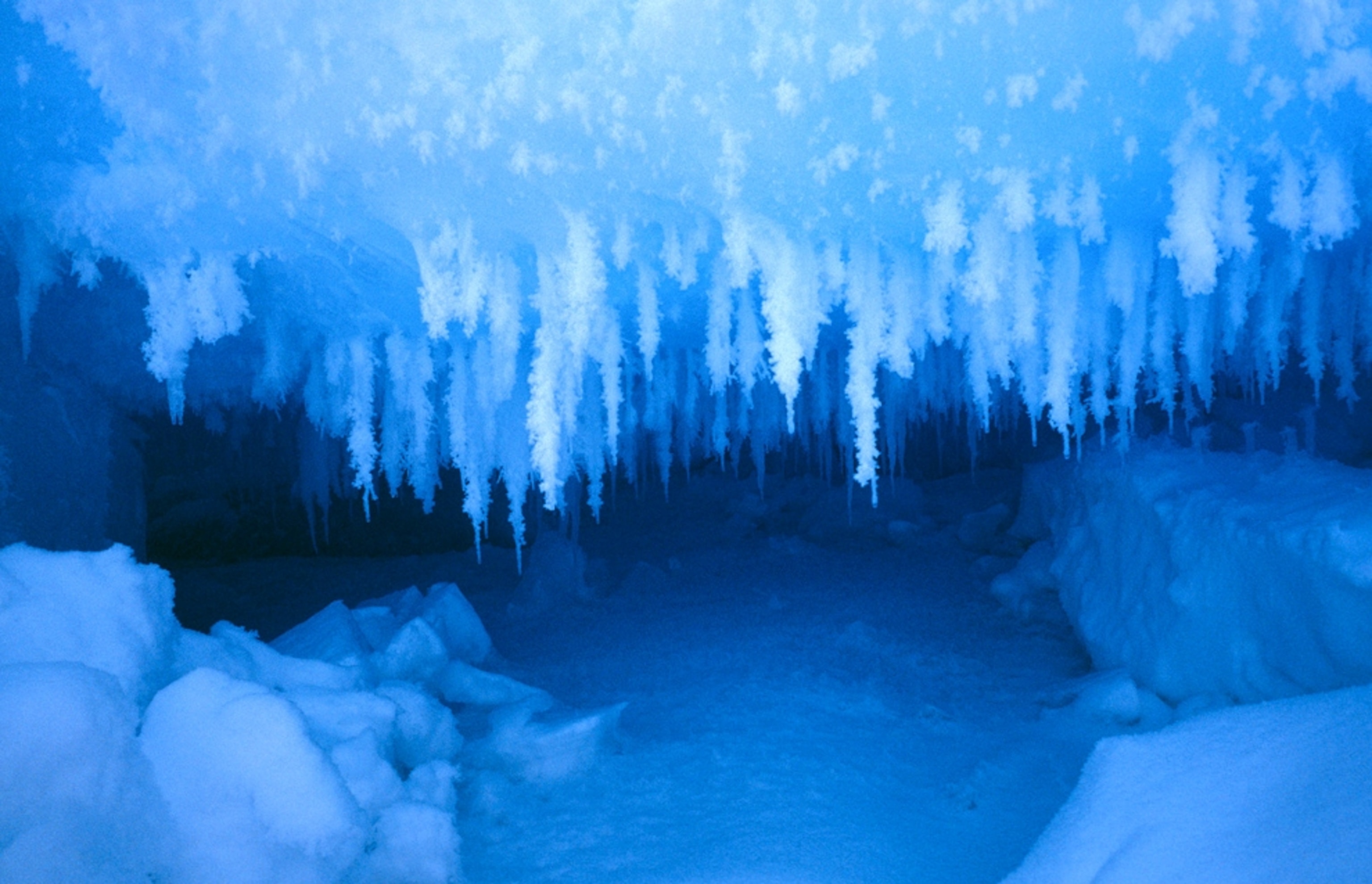 Small ice cave and icicles of rime