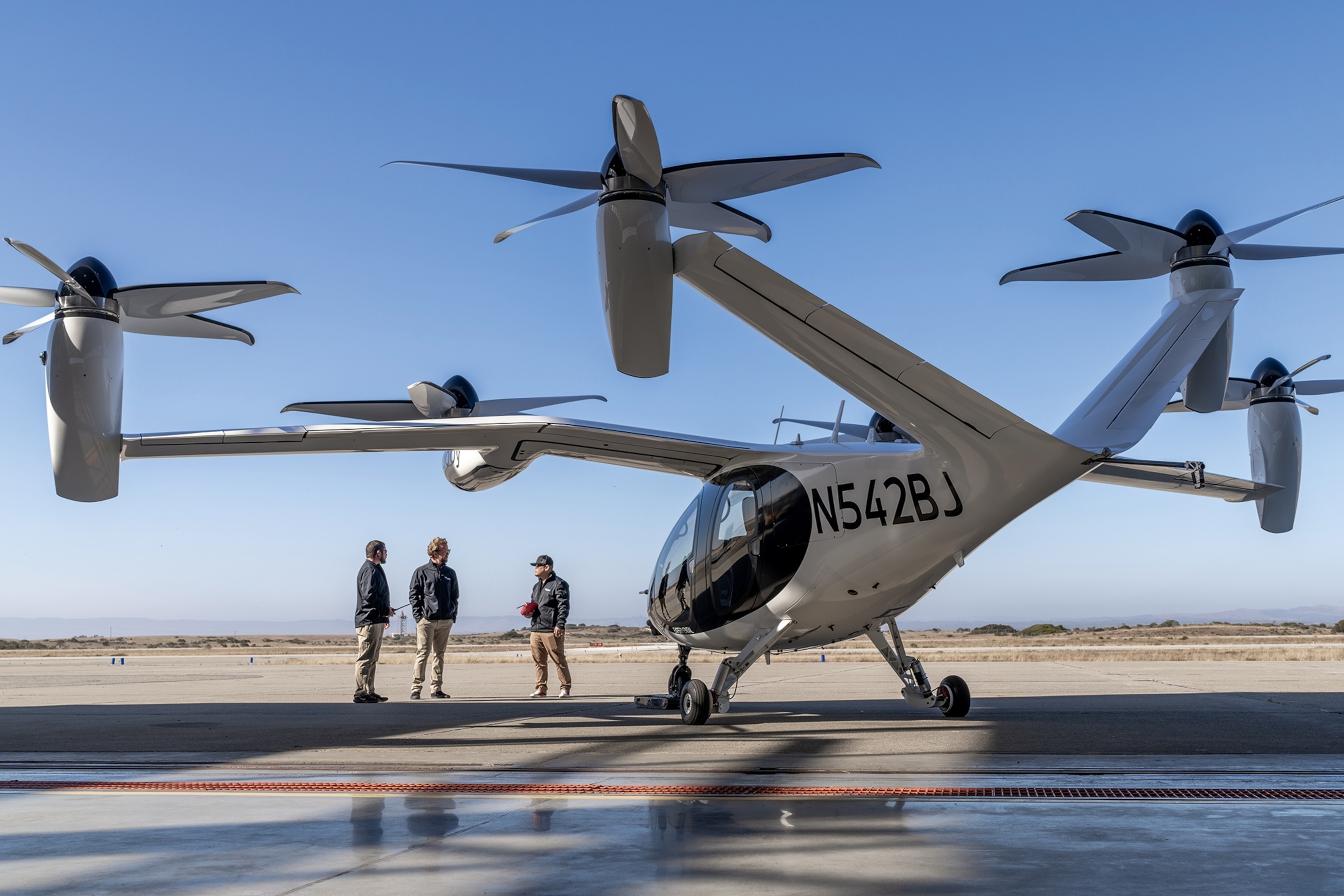 A picture of a flying taxi. The structure is similar to a helicopter with the addition of aircraft-like wings.