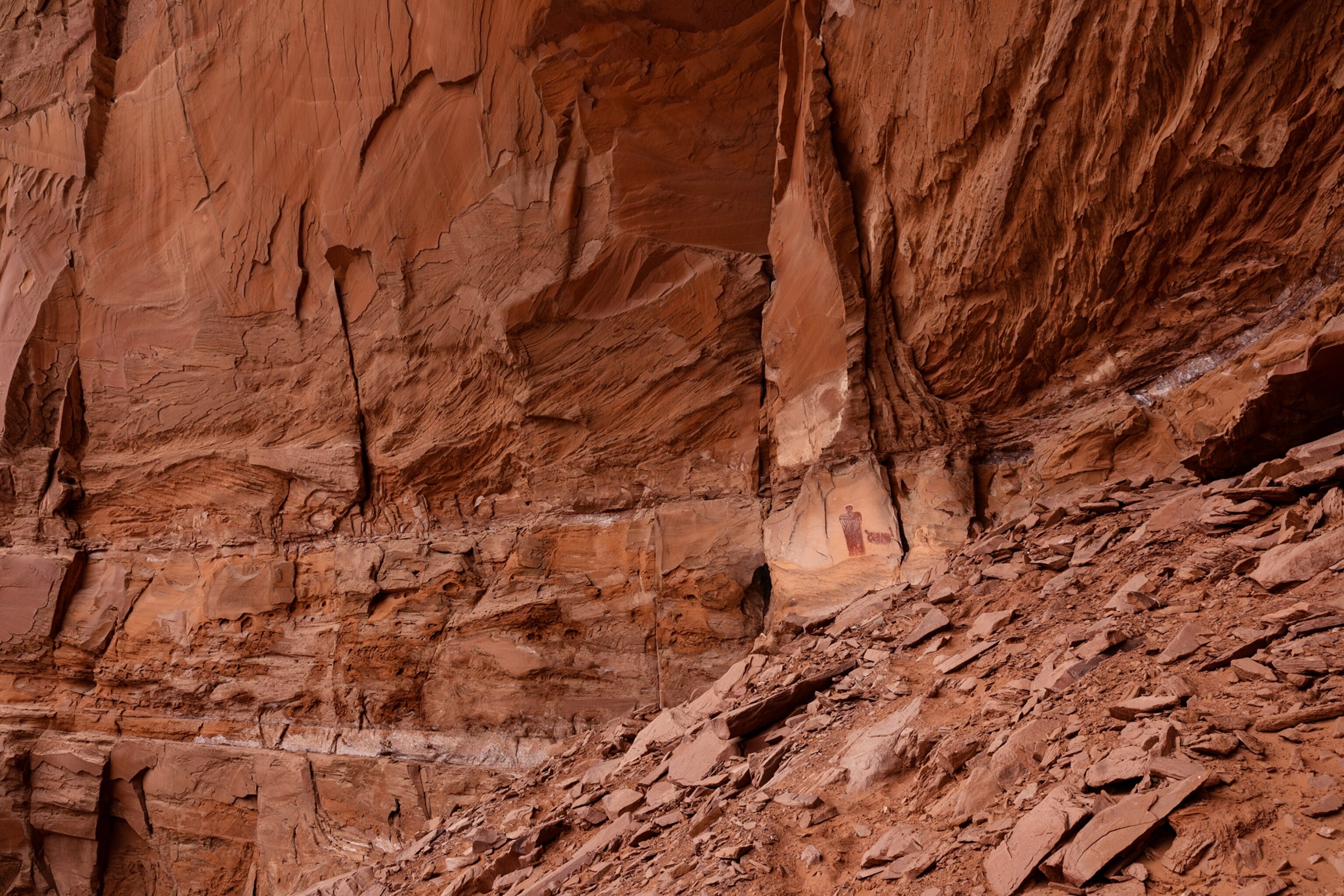Animal depicted on red cliff.