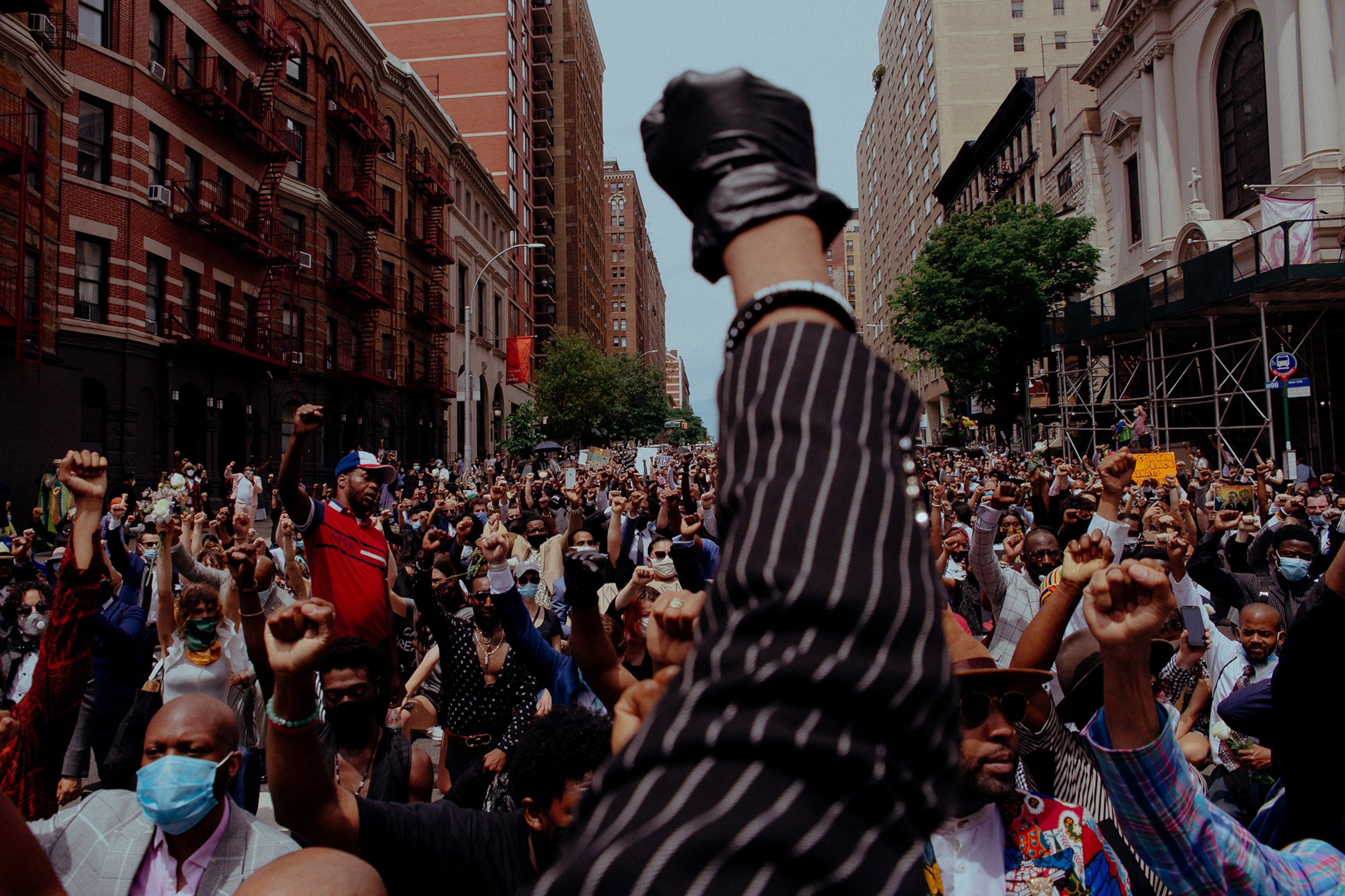 a fist raised in the air during a protest in New York City on 06/04/2020