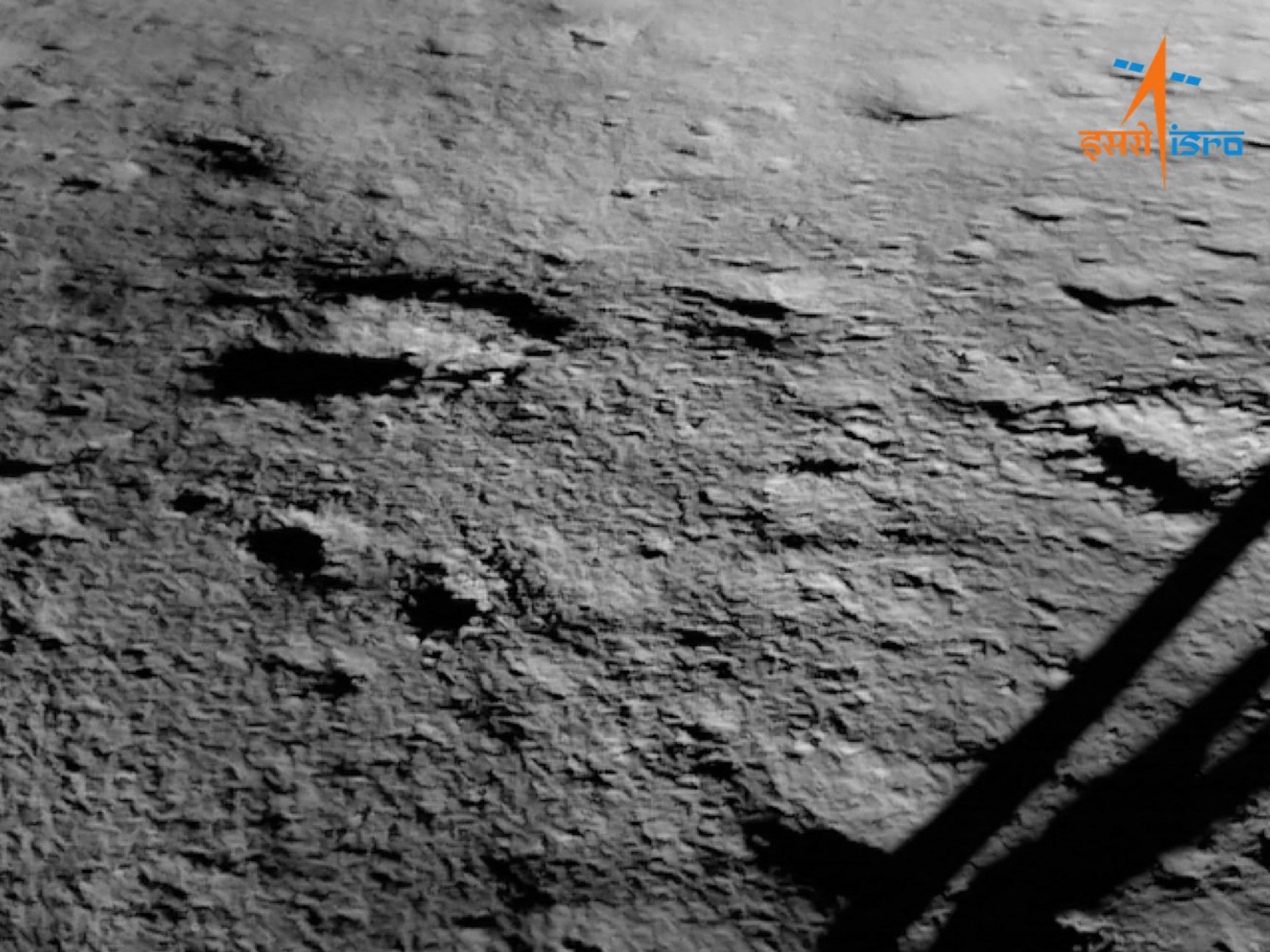 A black and white image of the moon's surface as seen from Chandrayaan-3 at the South Pole of Earth's moon.