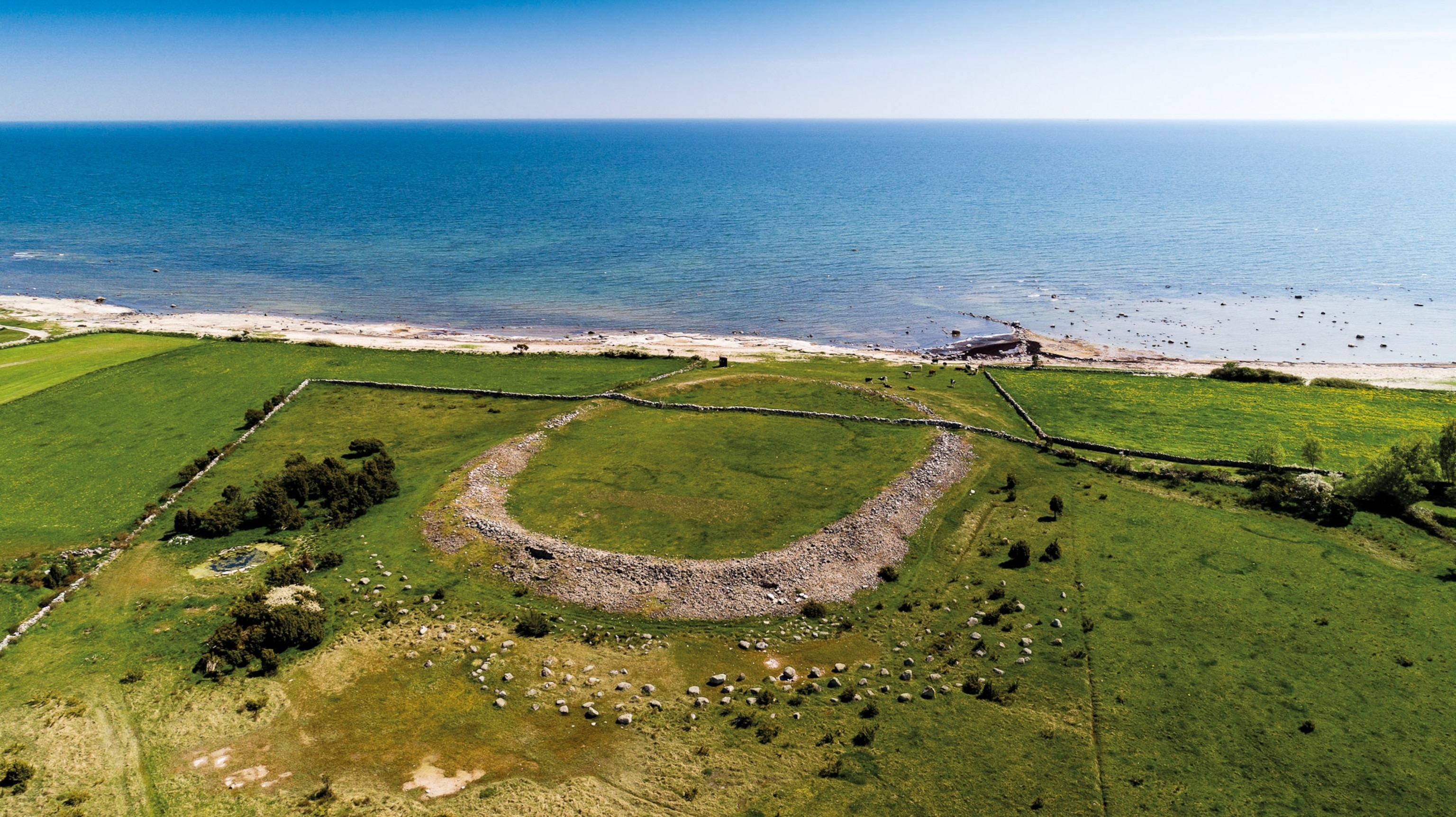 Sandby Borg lies on the east coast of the Swedish island of Öland in the Baltic Sea. Constructed around a.d. 400, its oval retaining wall was once more than 16 feet high. The stone wall that crosses it was built much later.