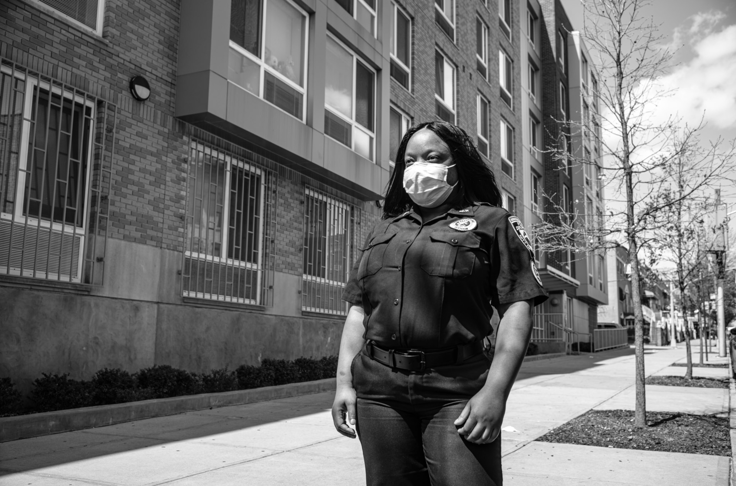 a woman in a uniform wearing a mask
