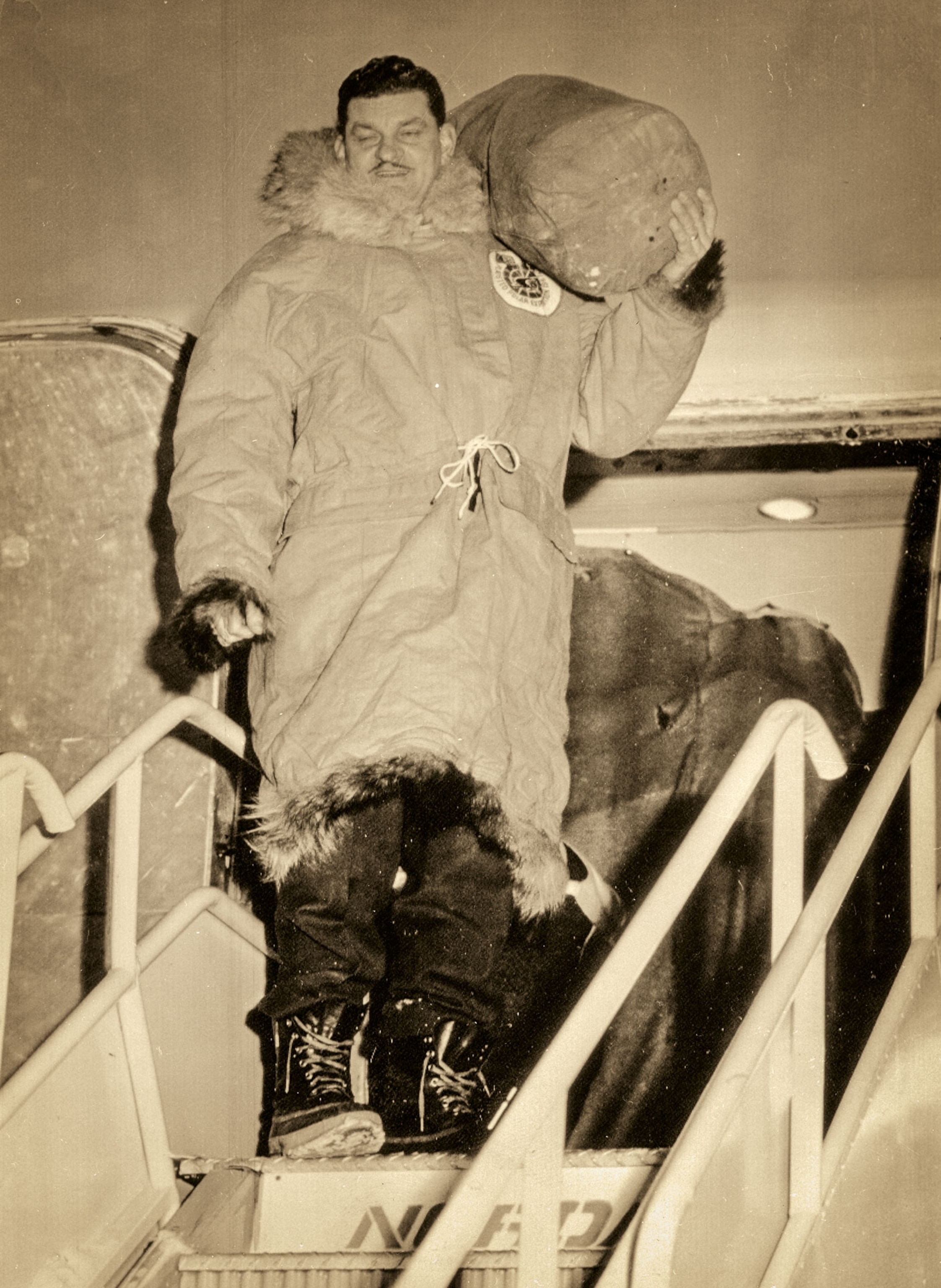 Ralph Plaisted boarding a plane in an early phase of his North Pole expedition
