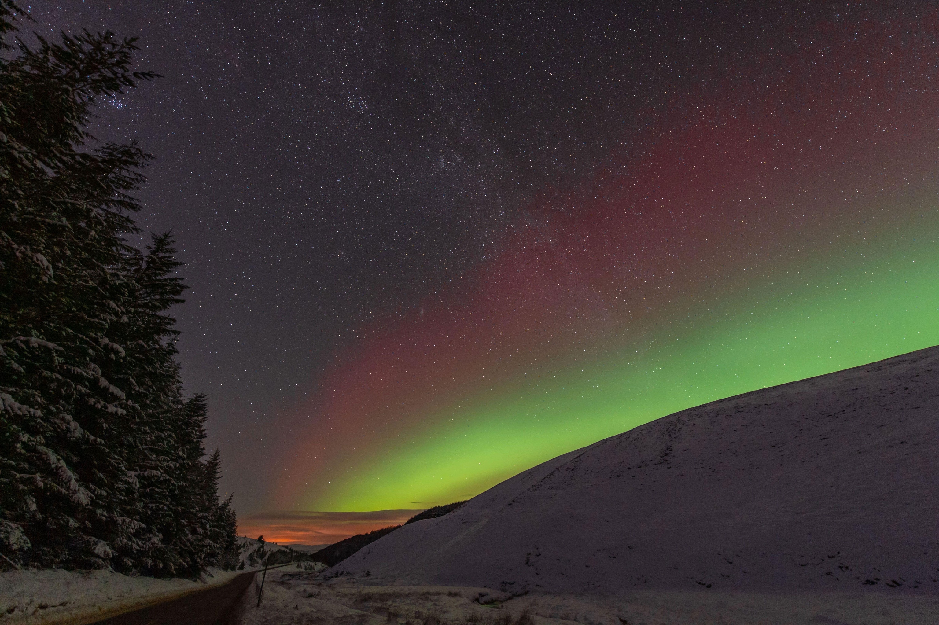 Northern lights over park with snow