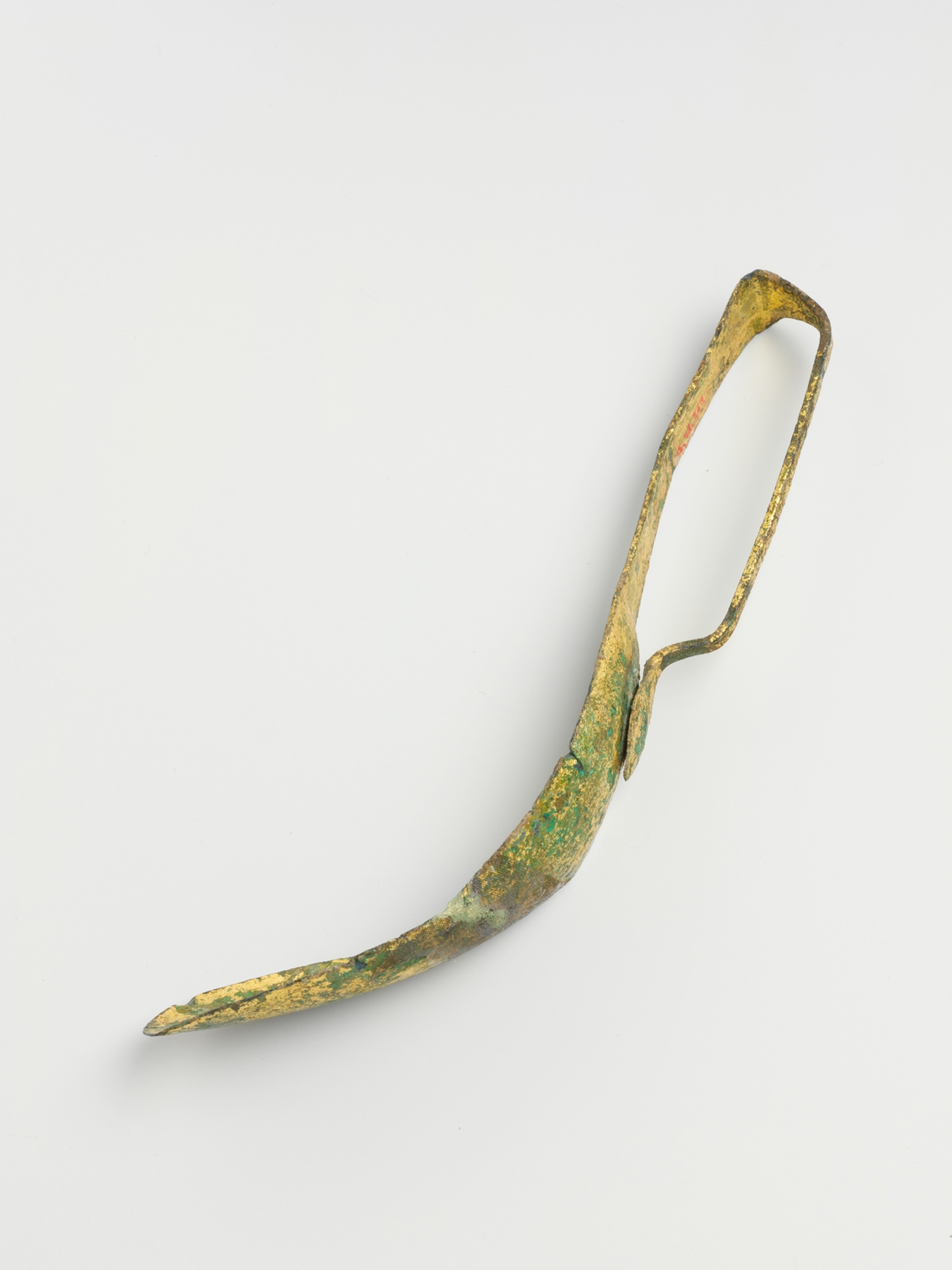 Gilt bronze strigil.