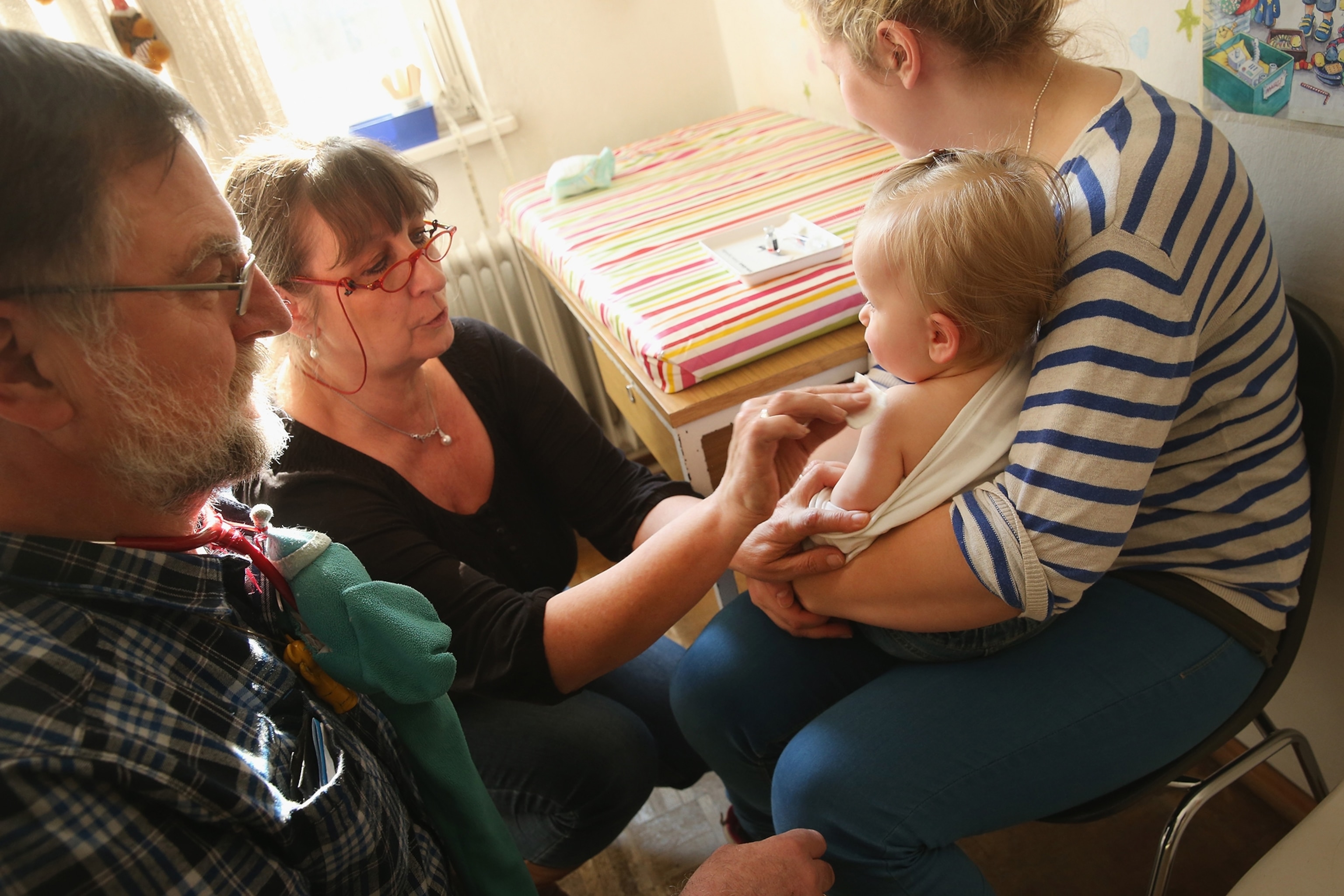 11-month-old Tijana preparing for a vaccine against measles.
