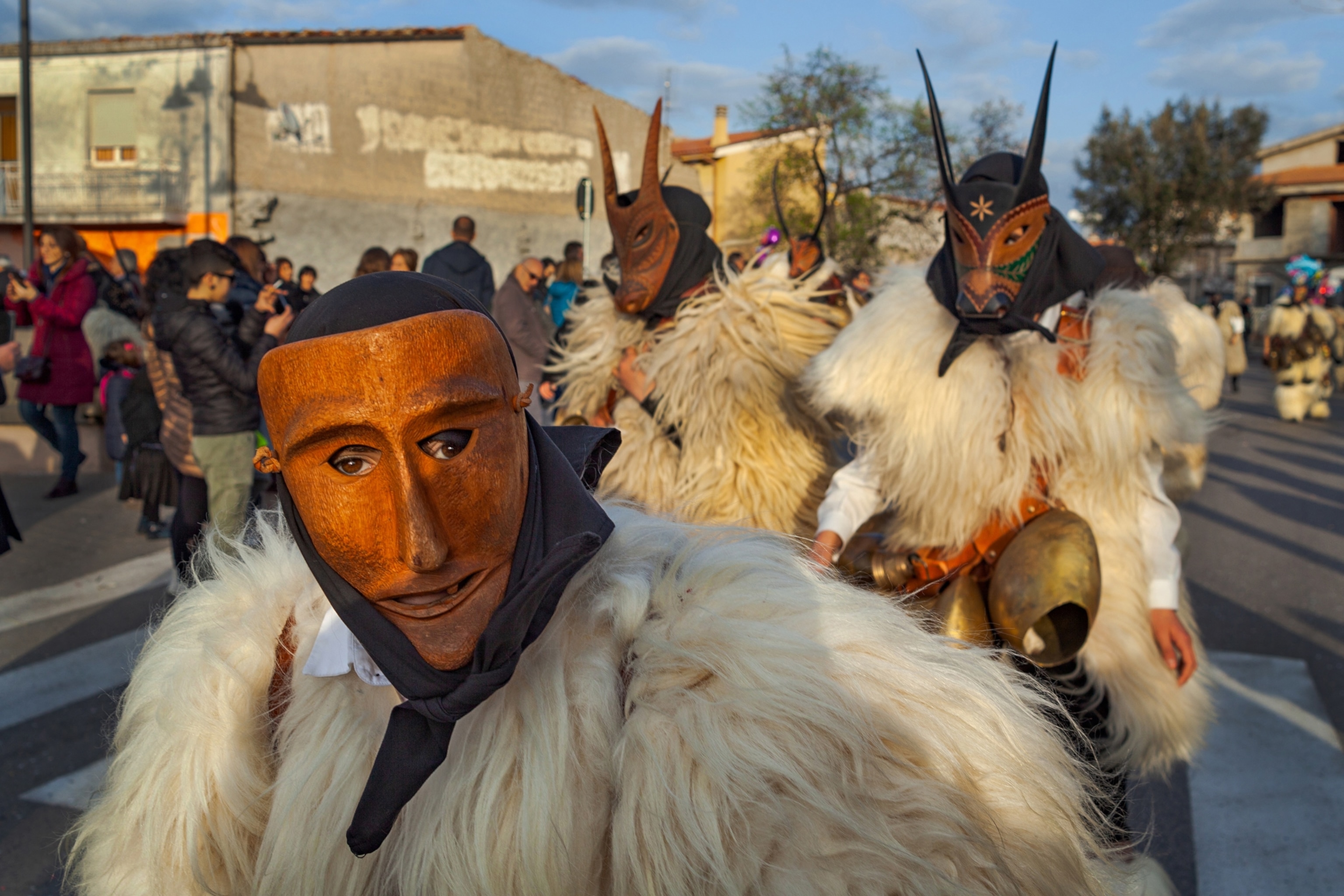 people in masks and animal skins.