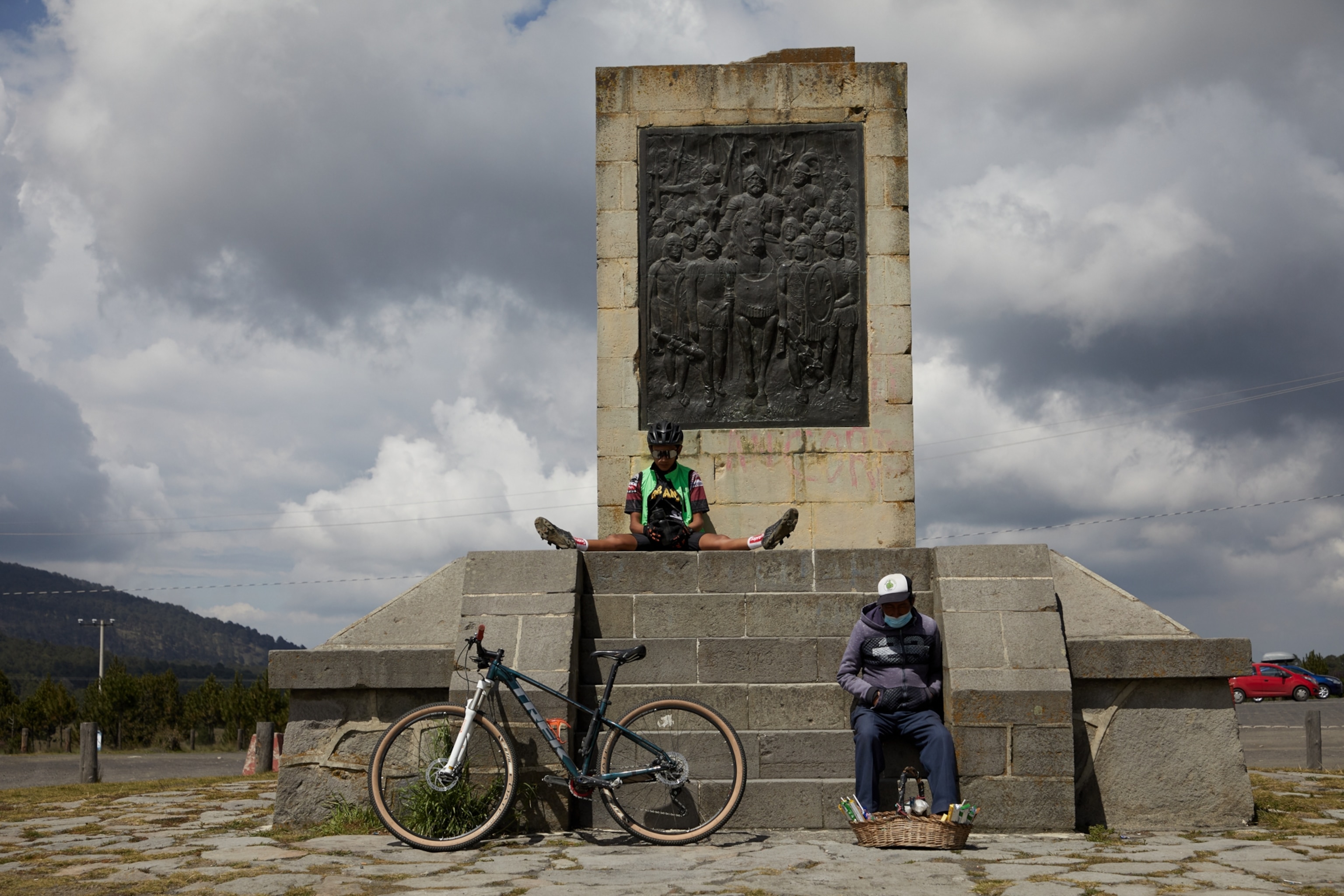 people sitting on the Amecameca Estado de México-Monument of Hernan Cortez