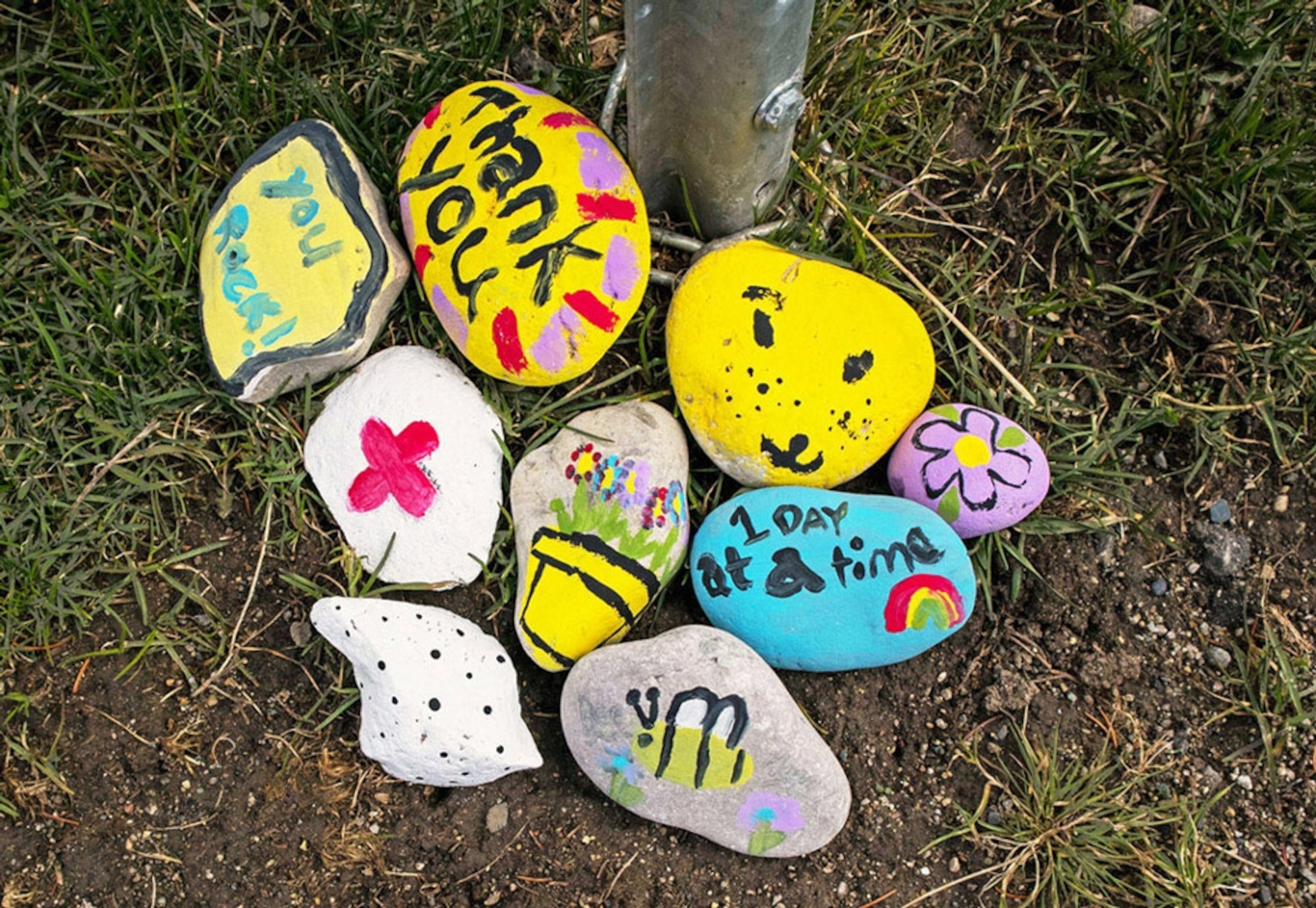 Rocks with painted on slogans to show gratitude.