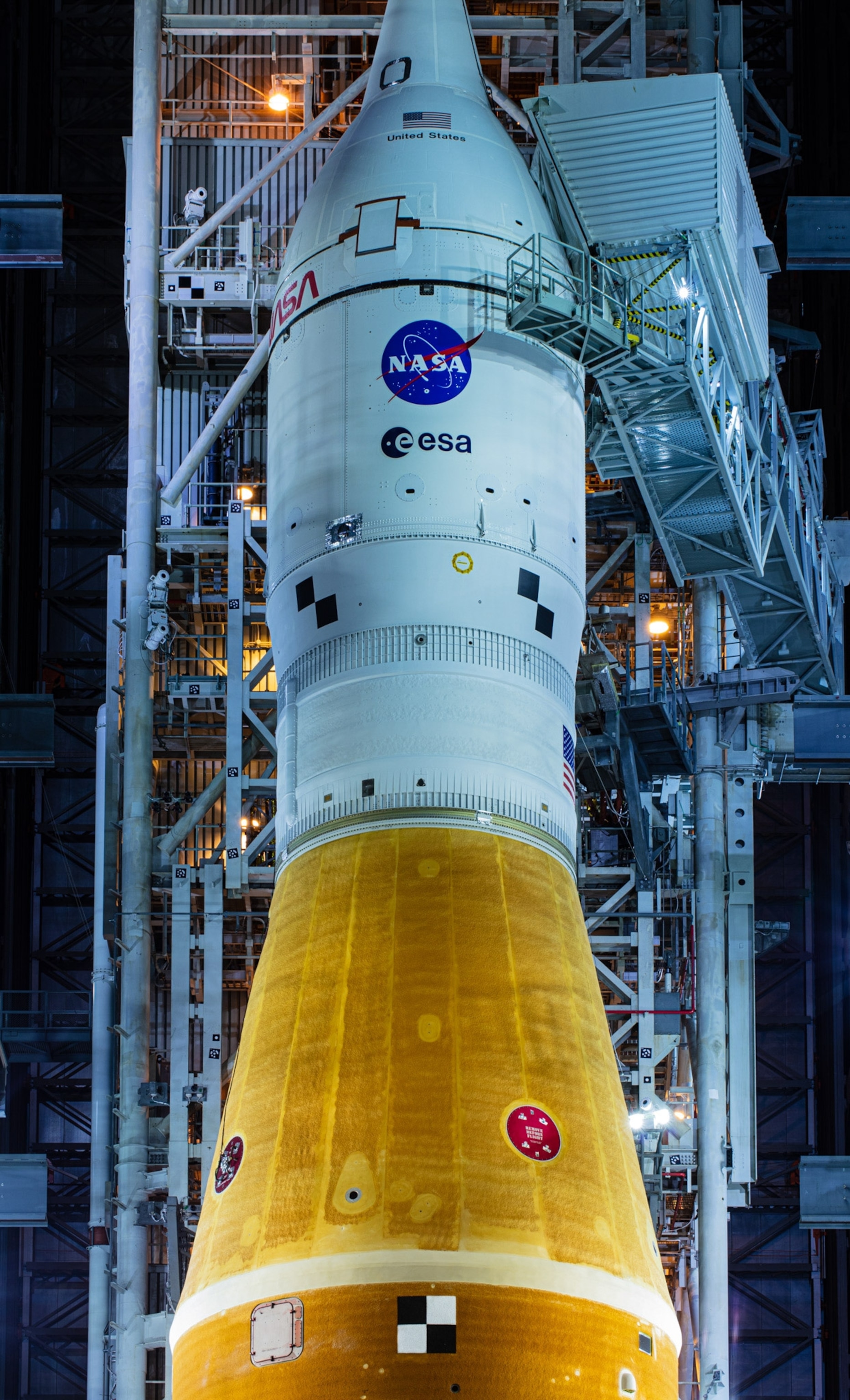 A spaceship named Artemis-1 before a rollout at Kennedy Space Center.