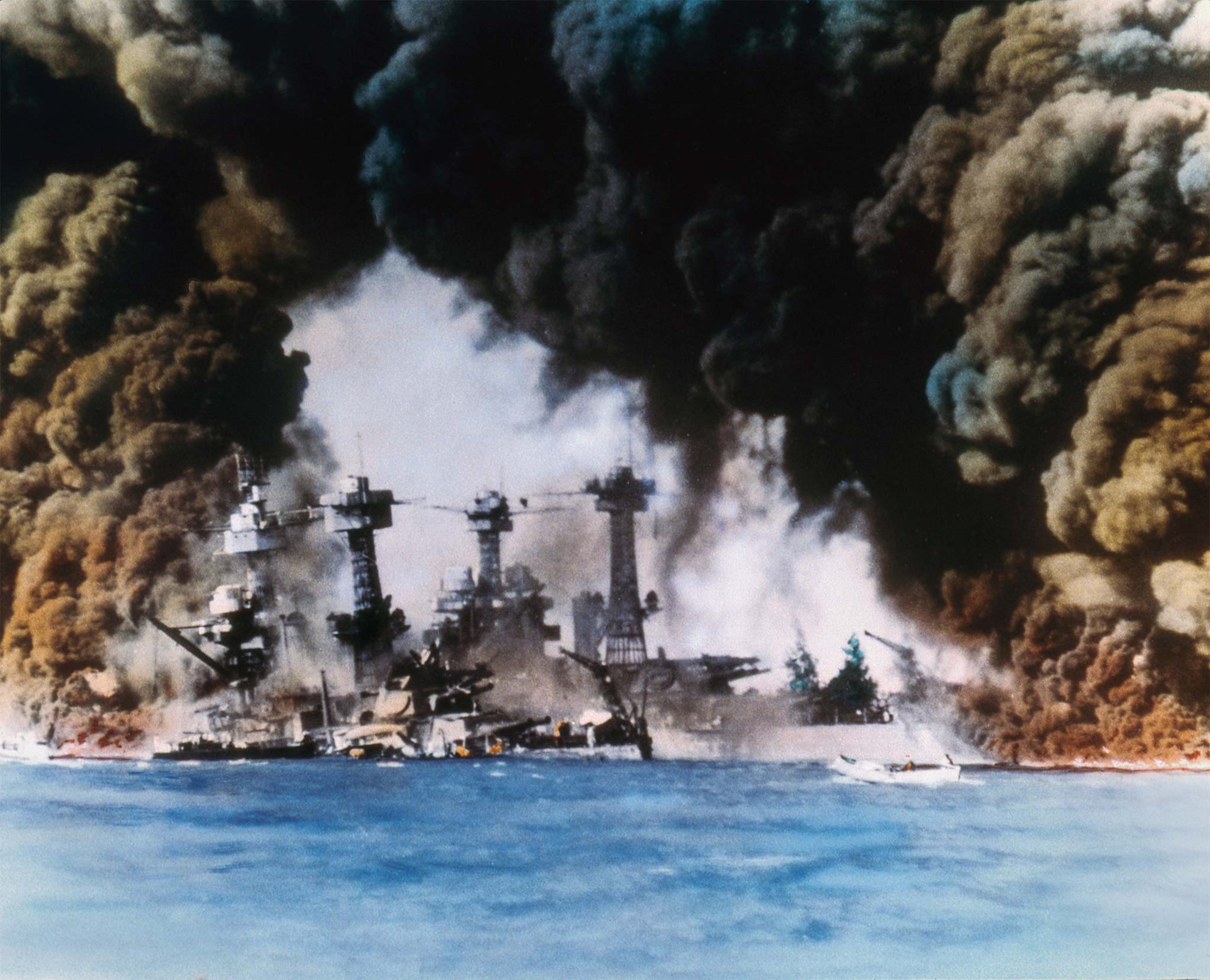 Smoke billows from stricken warships of the U.S. Pacific Fleet during the attack.