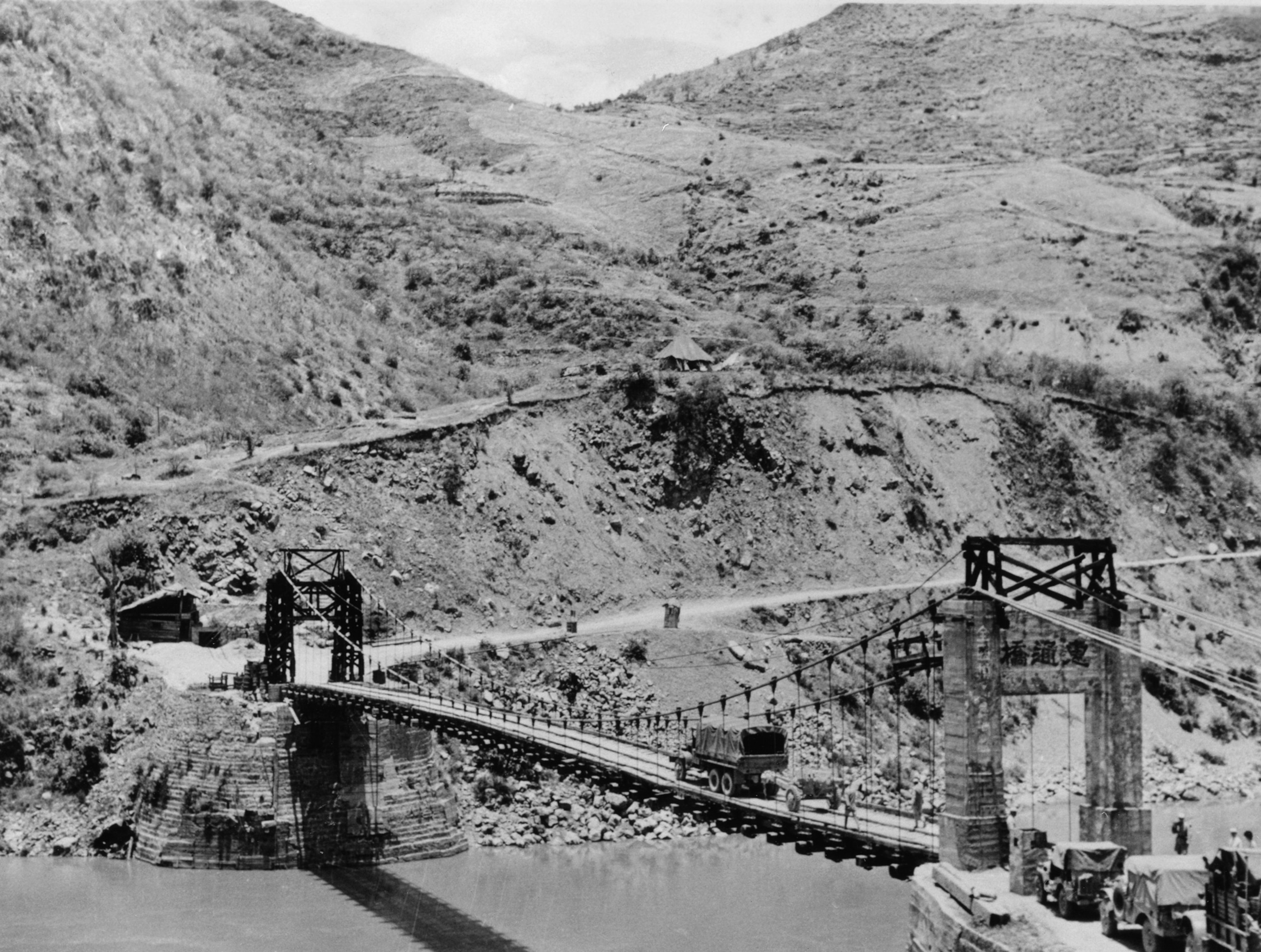 Photo of bridge and small roads over mountains