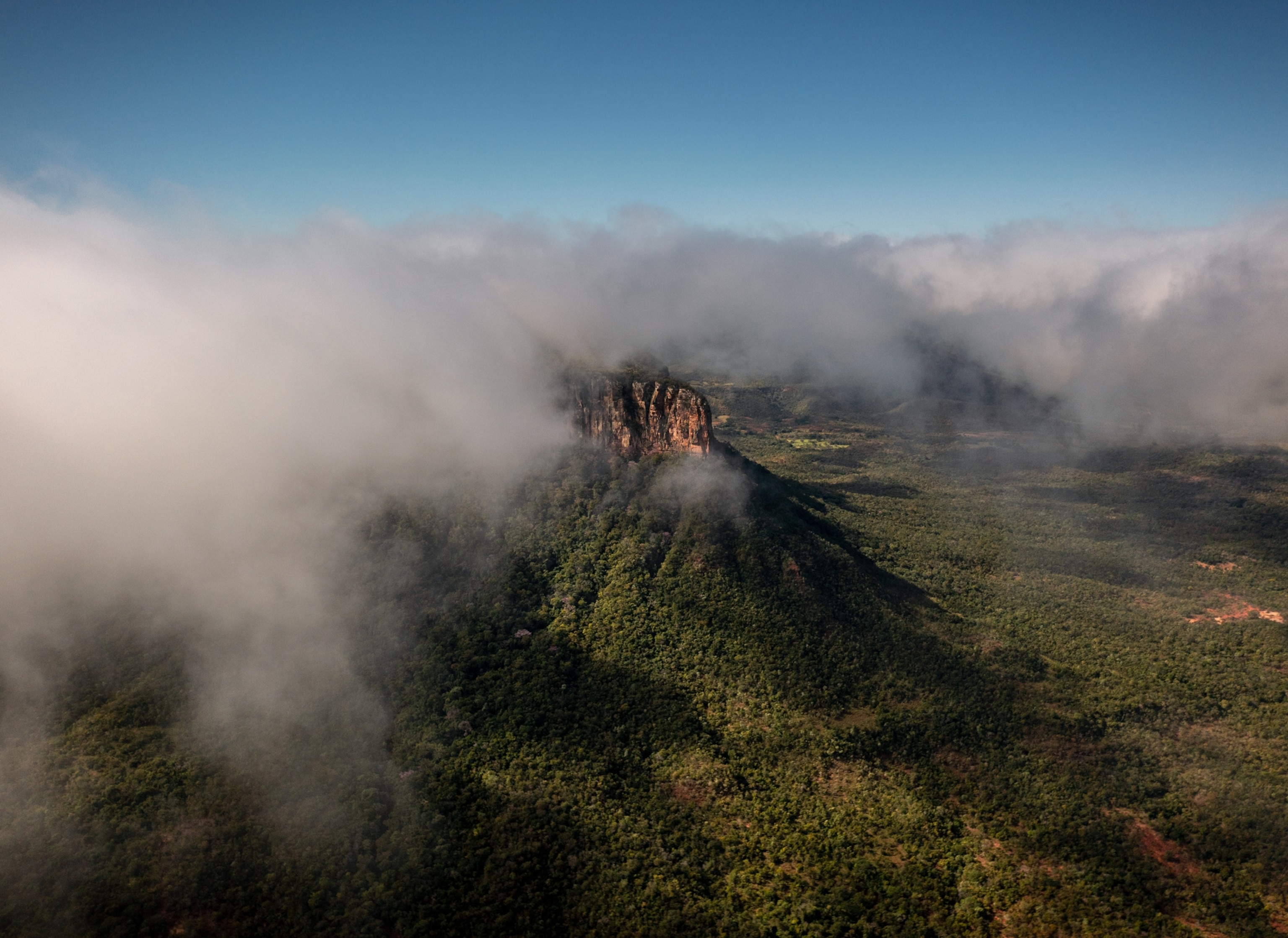 A drone shot of Furnas da Boa Sorte in the clouds