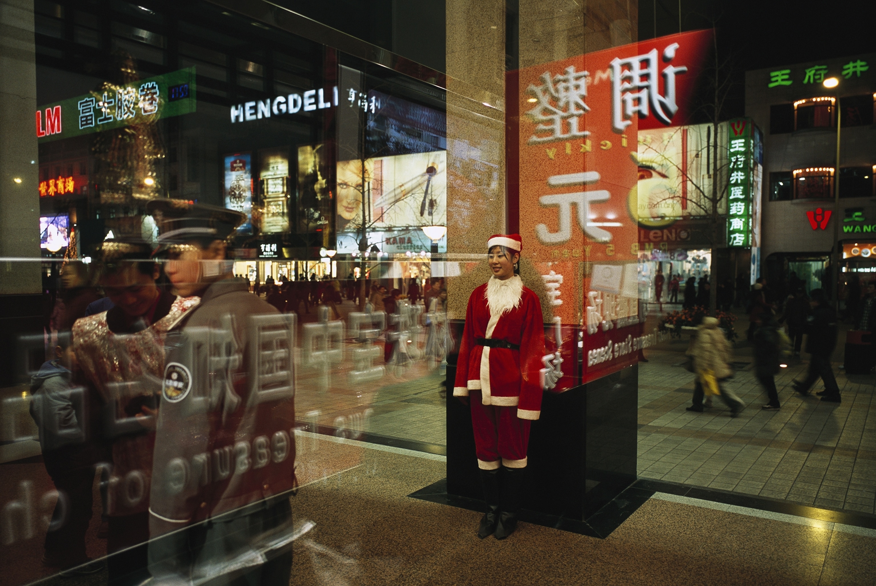 a young woman in a Santa Claus outfit in China