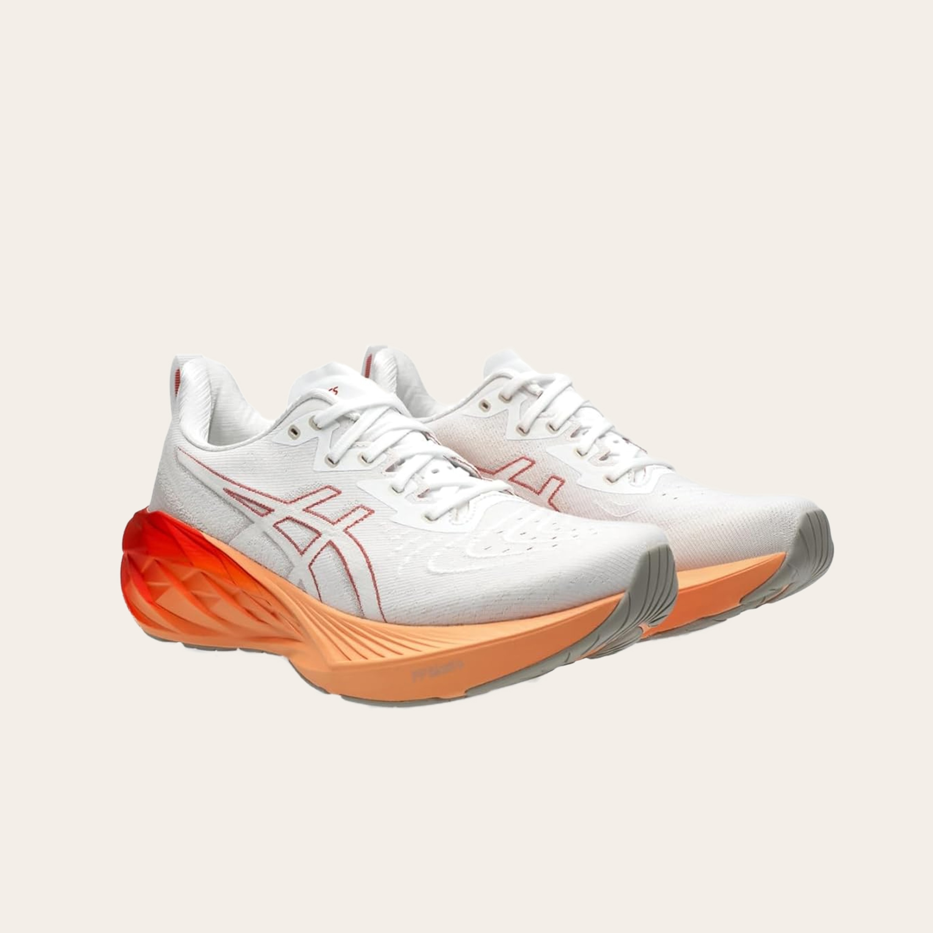 An image of white and orange sneakers.
