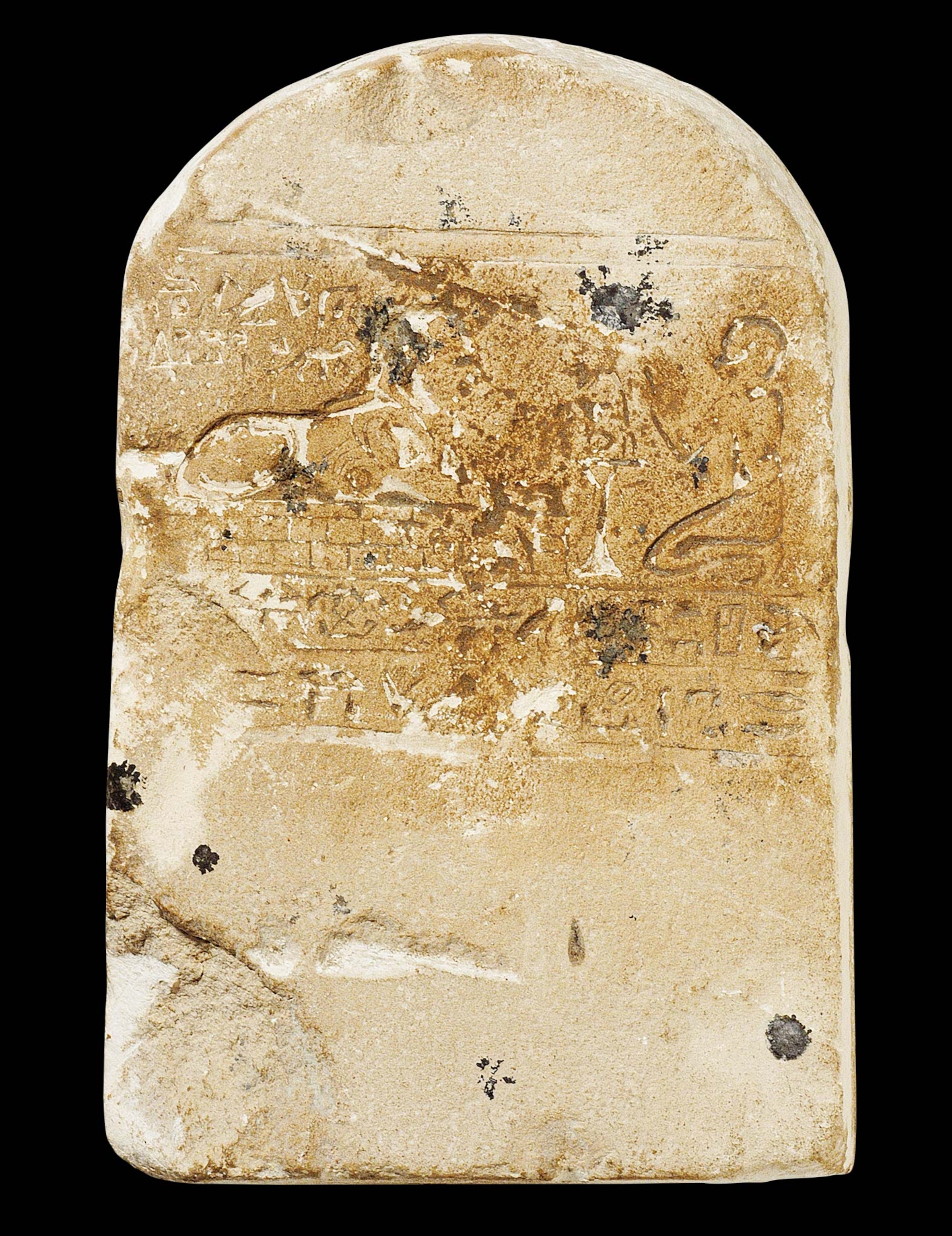 A sphinx receives prayers from a worshipper on this circa 16th-11th centuries B.C. votive stela from Giza.