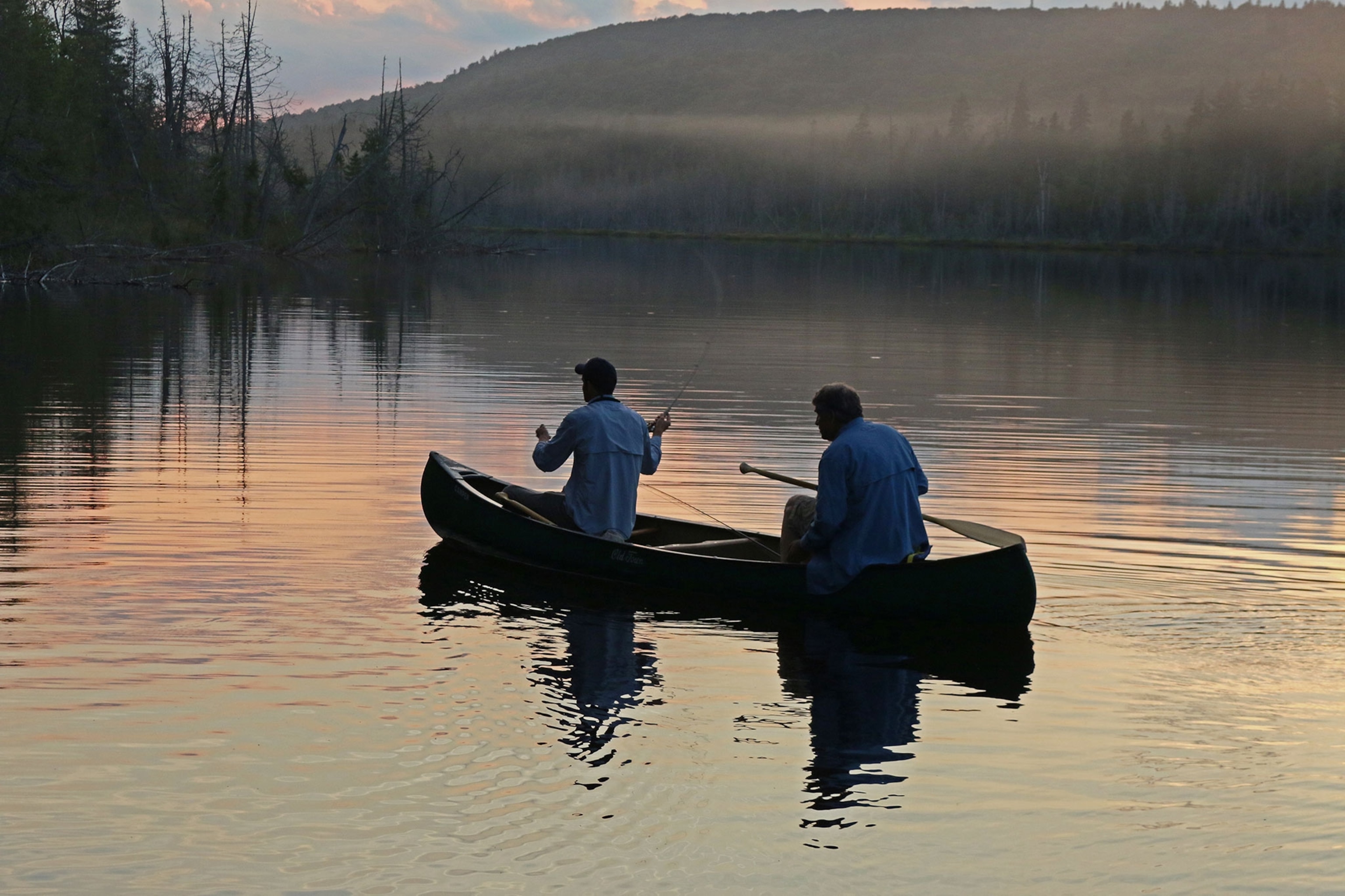 trout fishers in a canoe in Maine