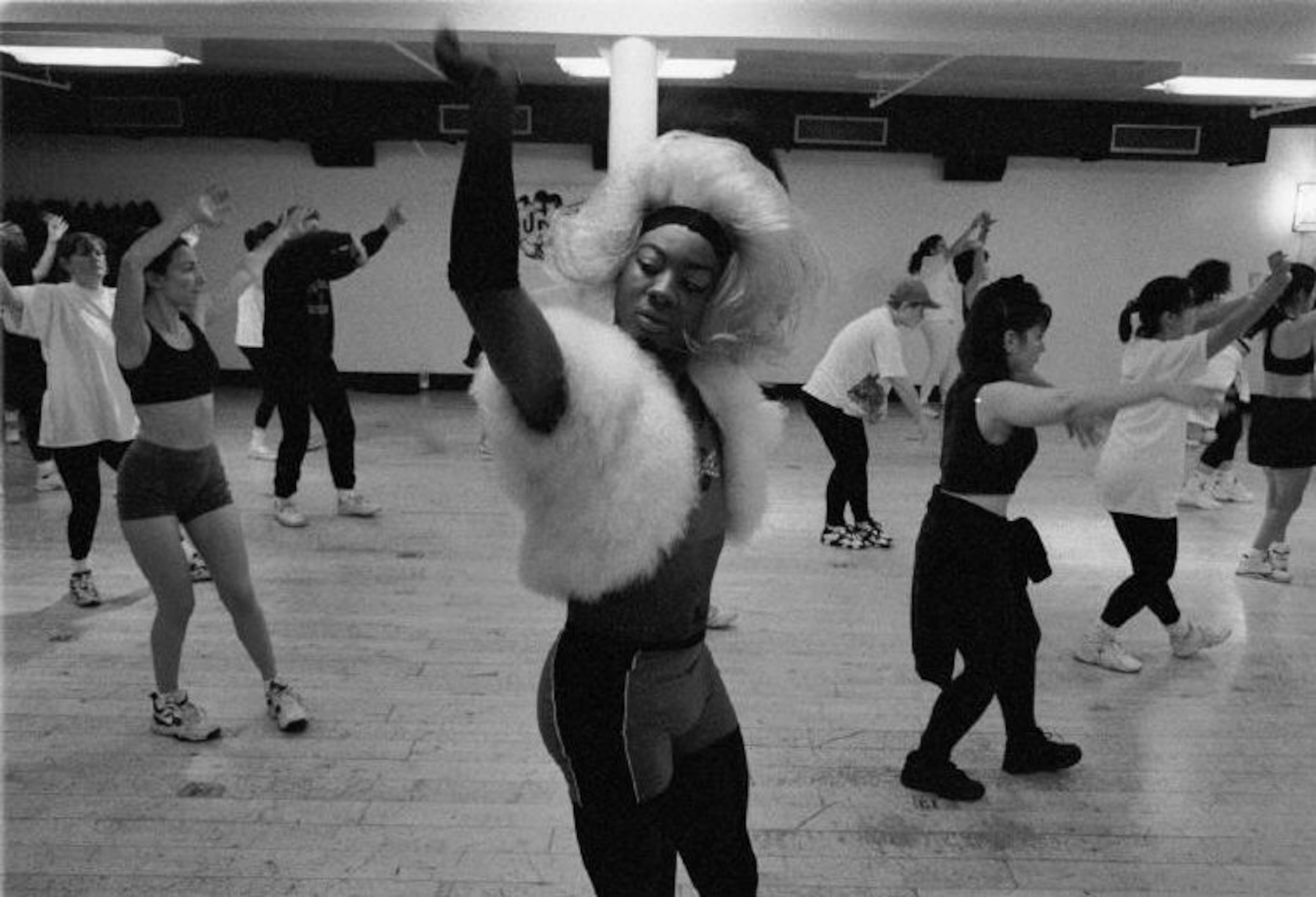 A black and white image of a dance class.