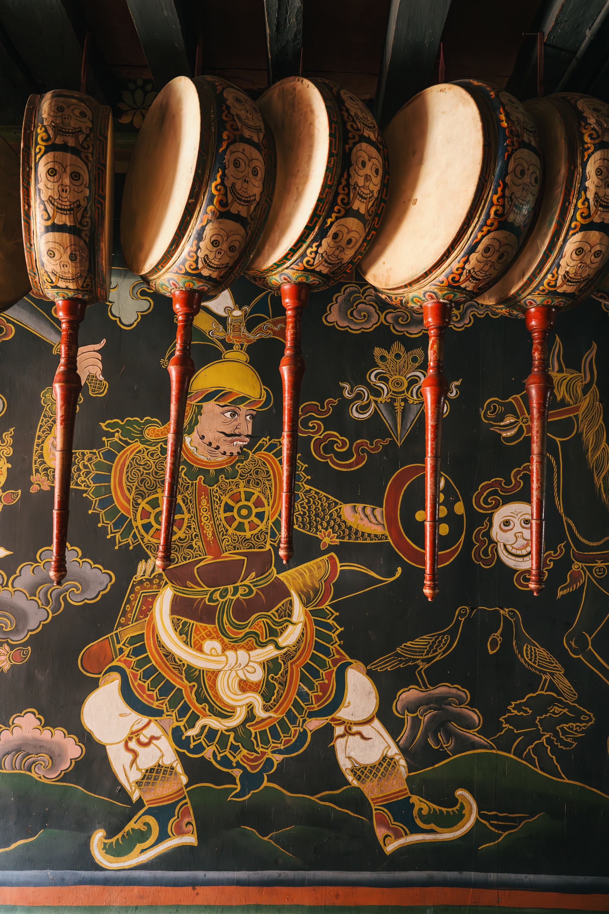 Bhutanese drums hung on a wall