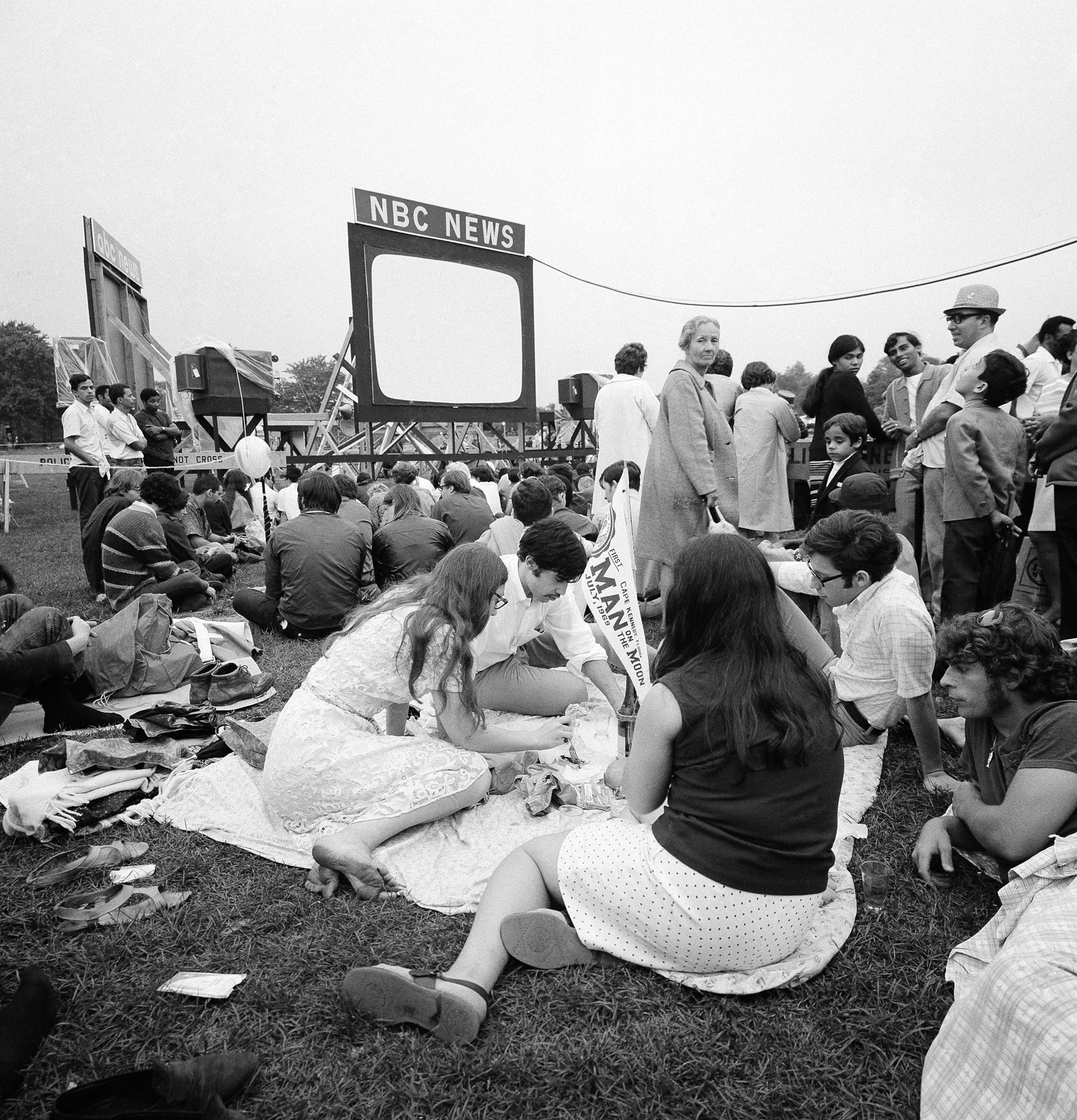 people sitting on the grass outside